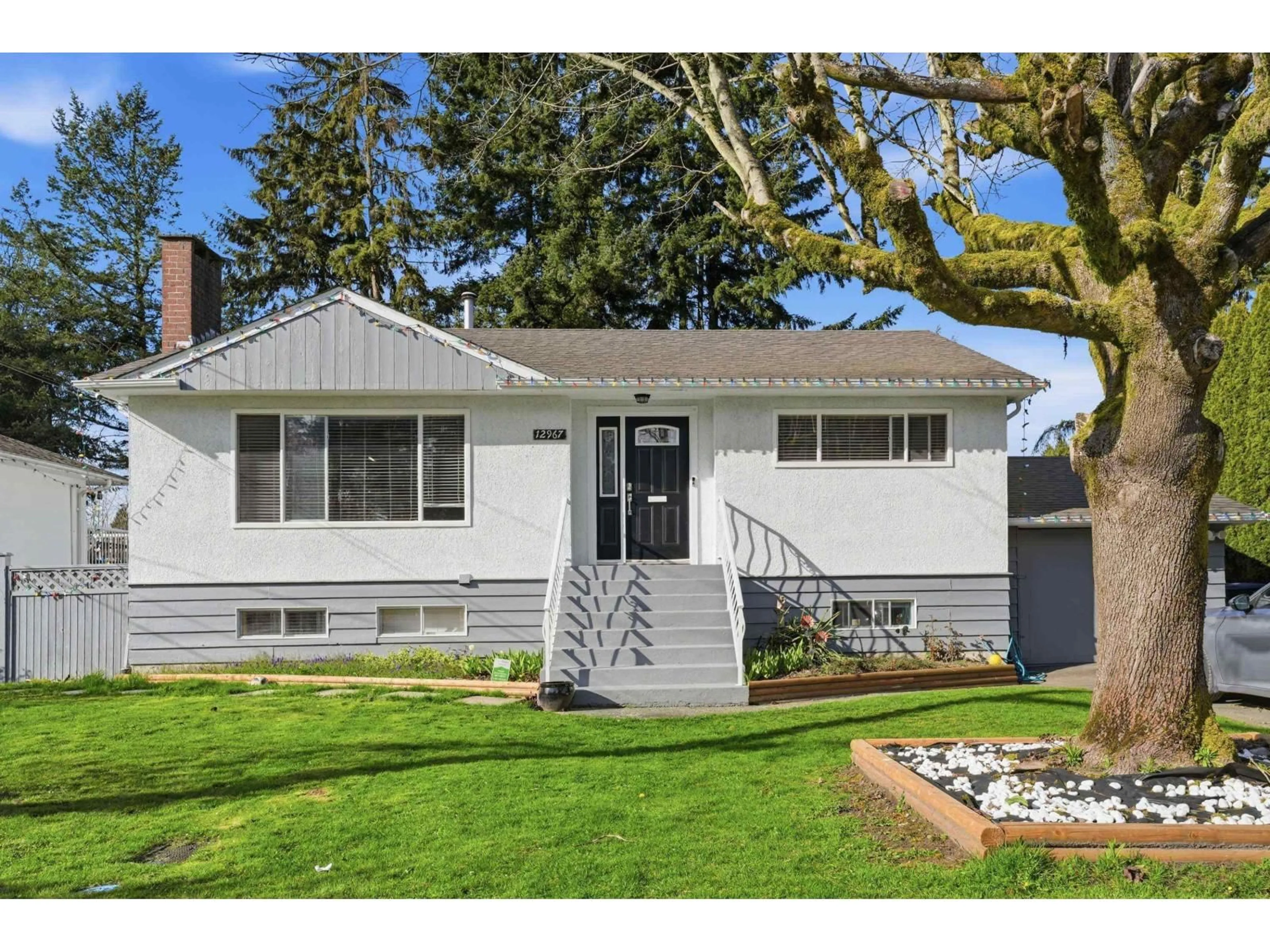 Home with vinyl exterior material, street for 12967 98A AVENUE, Surrey British Columbia V3T1C3