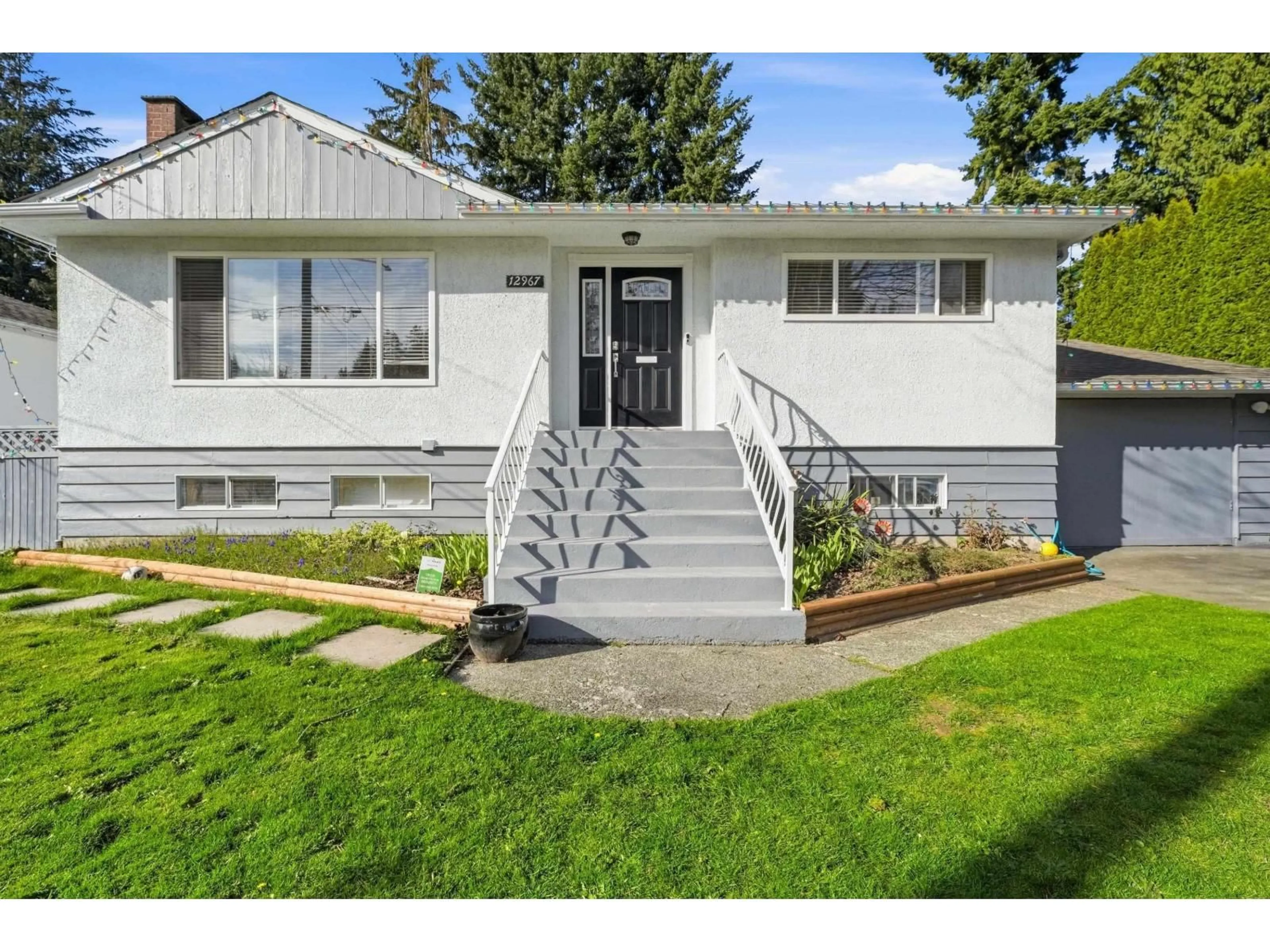 Home with vinyl exterior material, street for 12967 98A AVENUE, Surrey British Columbia V3T1C3