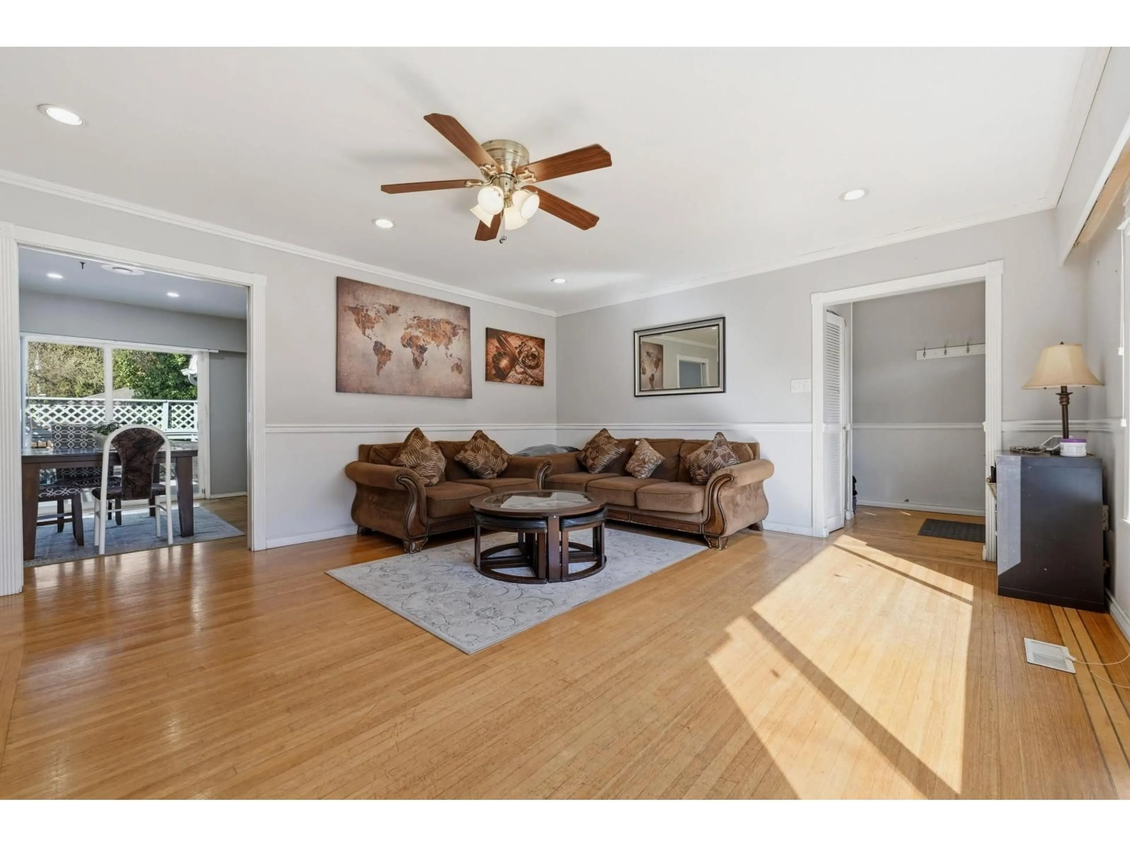 Living room with furniture, wood/laminate floor for 12967 98A AVENUE, Surrey British Columbia V3T1C3