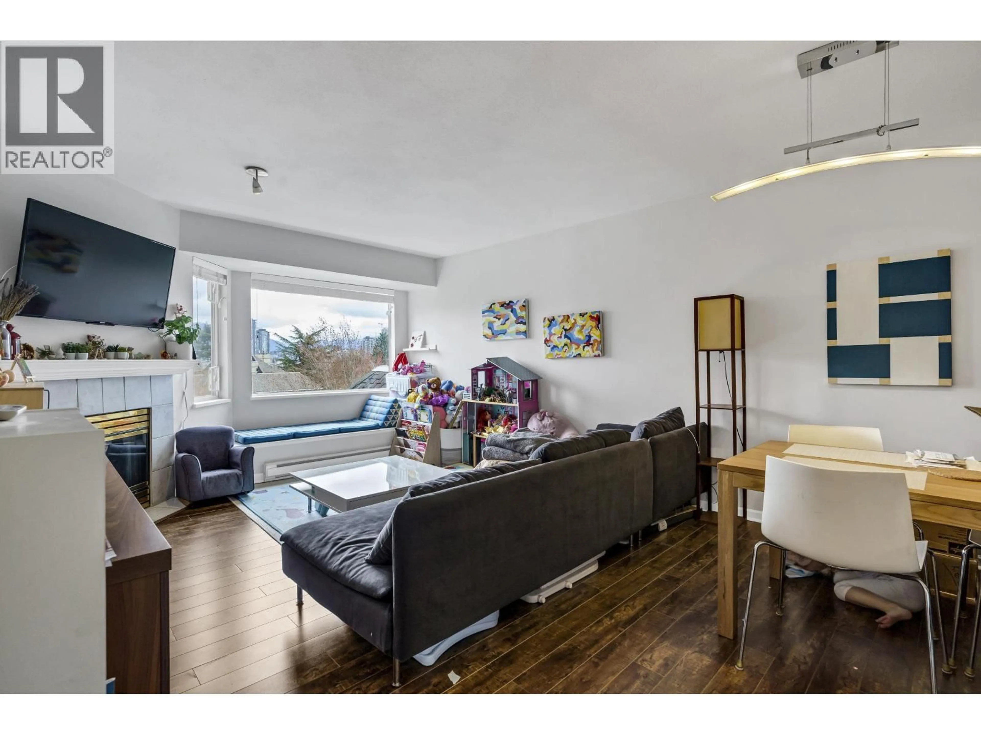 Living room with furniture, wood/laminate floor for 403 - 3738 NORFOLK STREET, Burnaby British Columbia V5G4V4