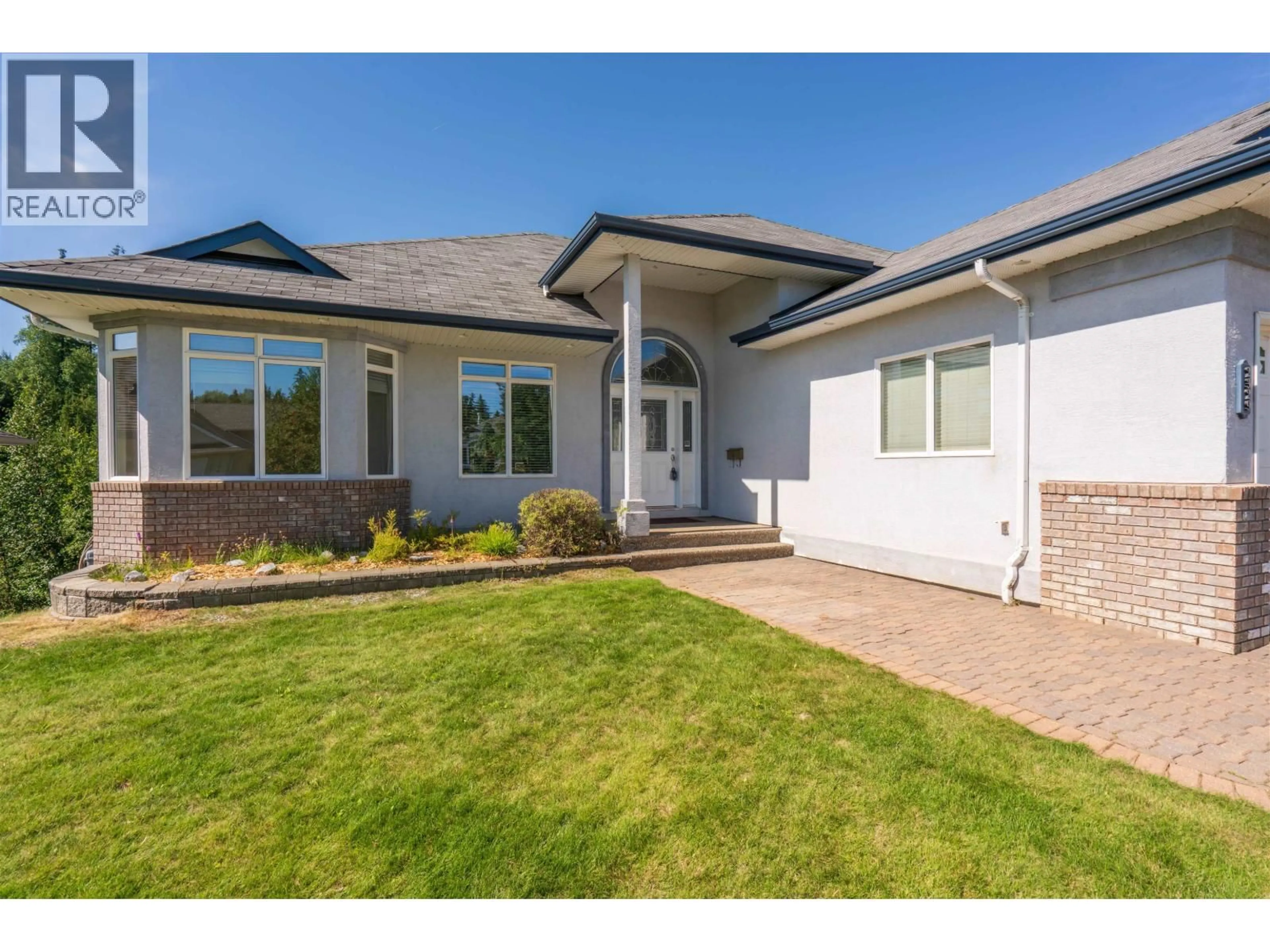 Home with vinyl exterior material, street for 2329 MCTAVISH ROAD, Prince George British Columbia V2K5R5