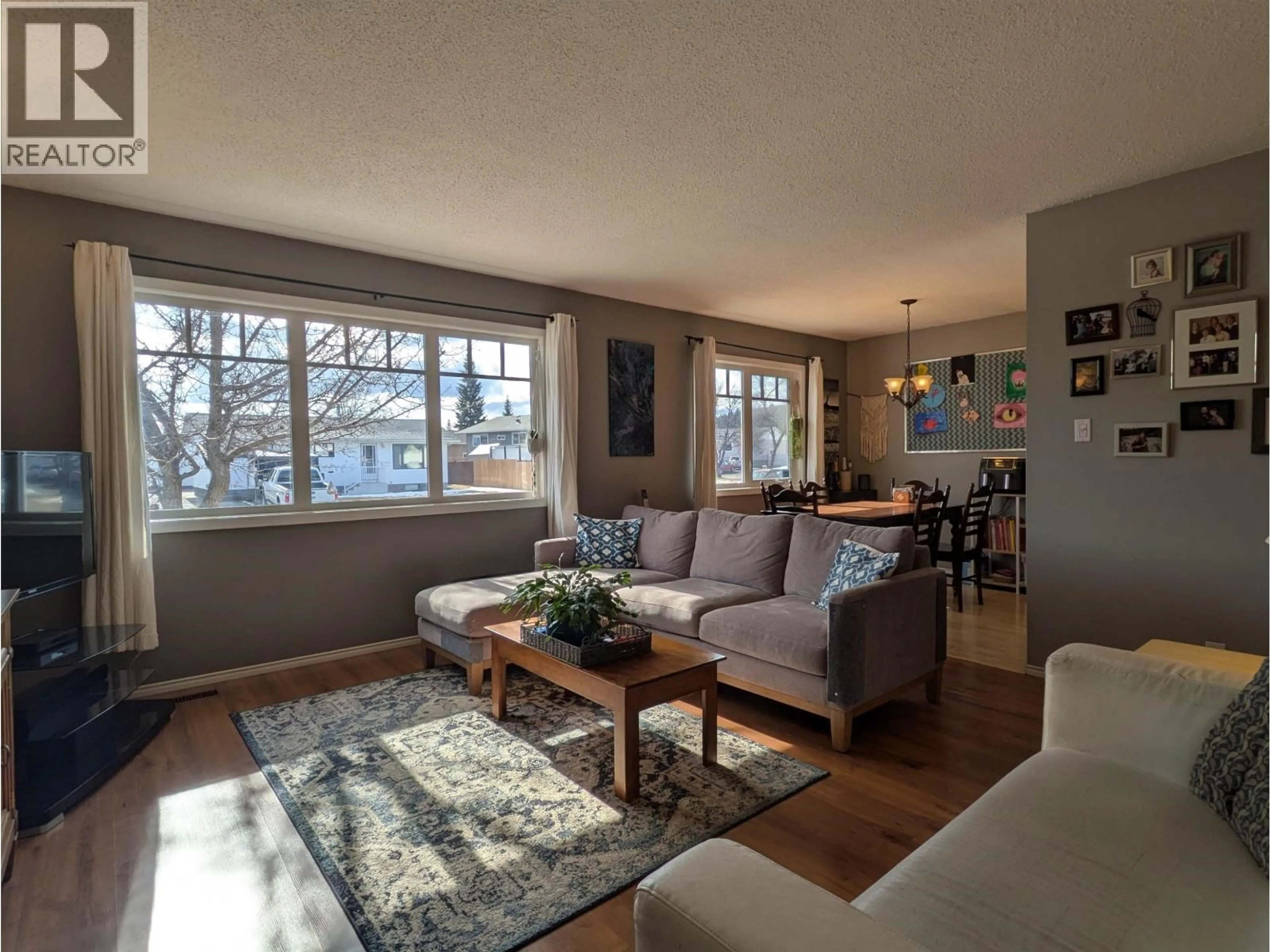 Living room with furniture, wood/laminate floor for 3930 ENEMARK CRESCENT, Prince George British Columbia V2N2X5