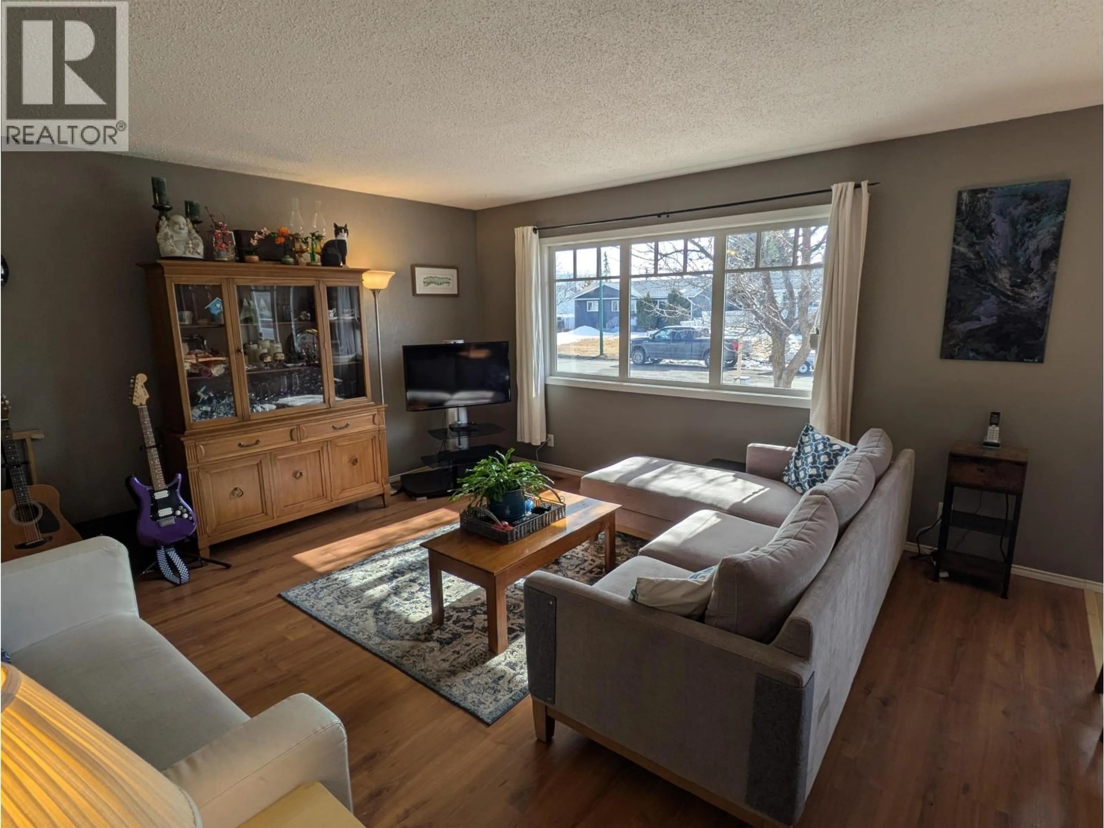 Living room with furniture, wood/laminate floor for 3930 ENEMARK CRESCENT, Prince George British Columbia V2N2X5
