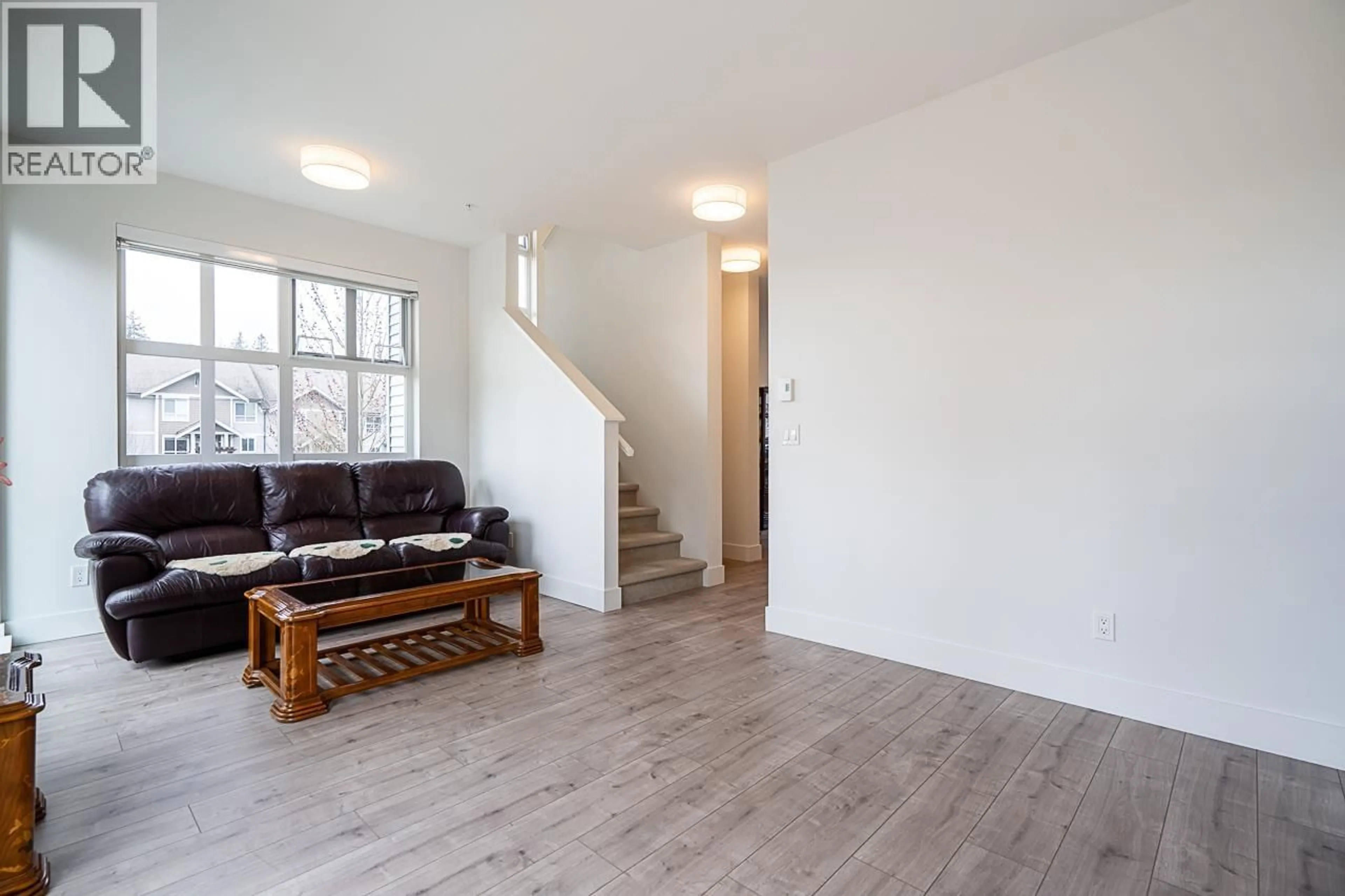 Living room with furniture, wood/laminate floor for 130 - 24076 112 AVENUE, Maple Ridge British Columbia V2W0K2