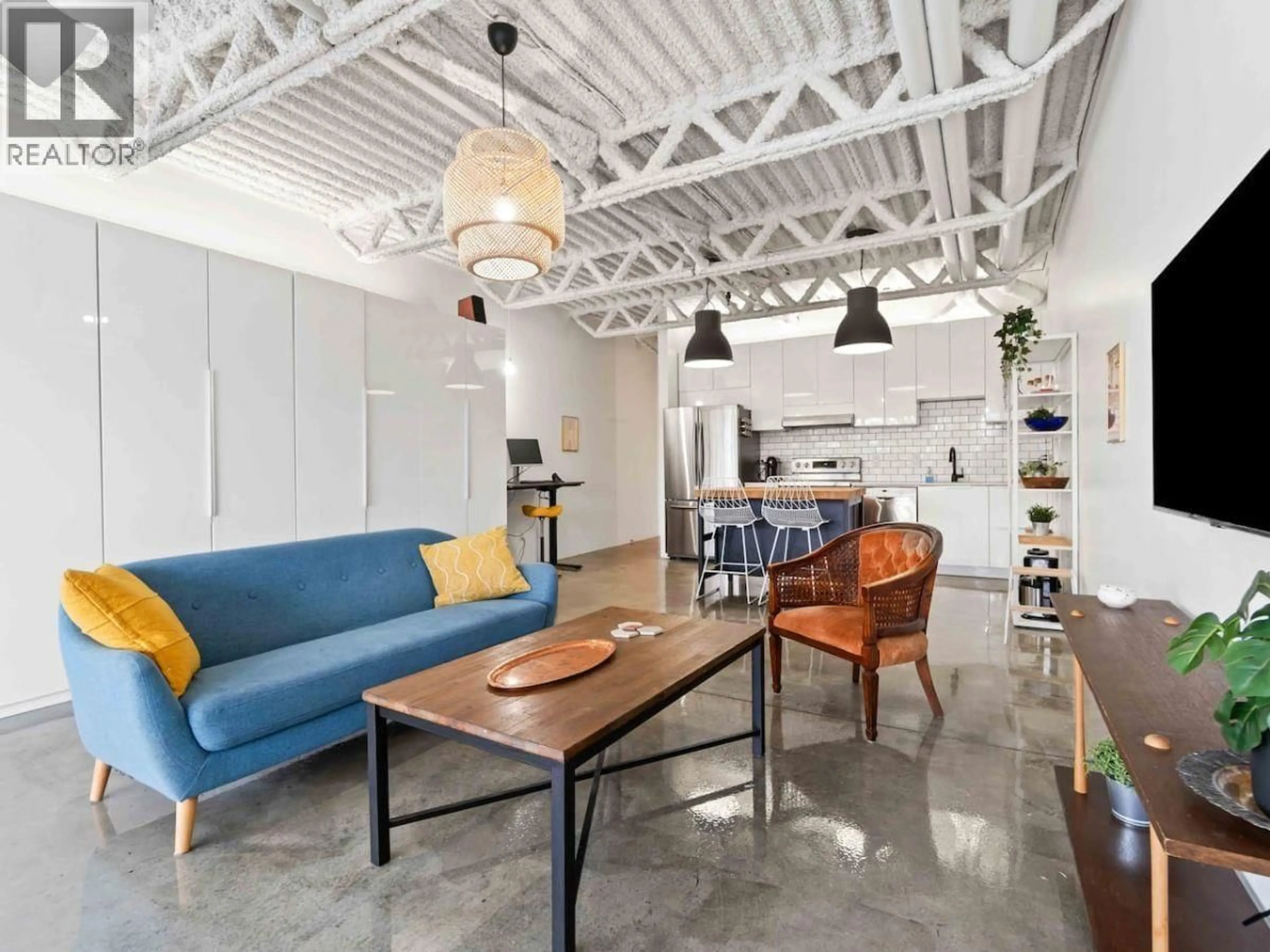 Living room with furniture, cement floor for 330 - 350 E 2ND AVENUE, Vancouver British Columbia V5T4R8