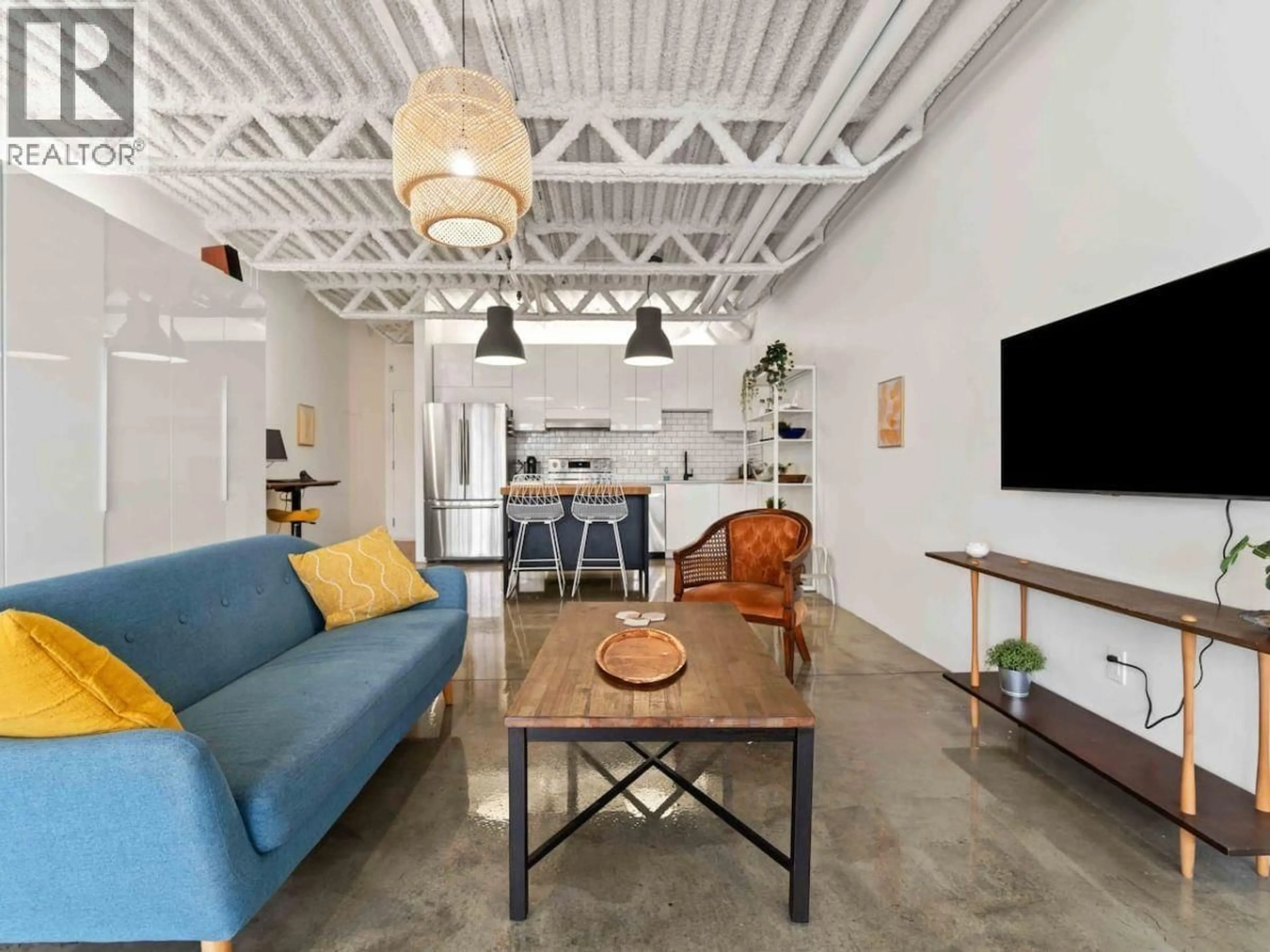 Living room with furniture, cement floor for 330 - 350 E 2ND AVENUE, Vancouver British Columbia V5T4R8