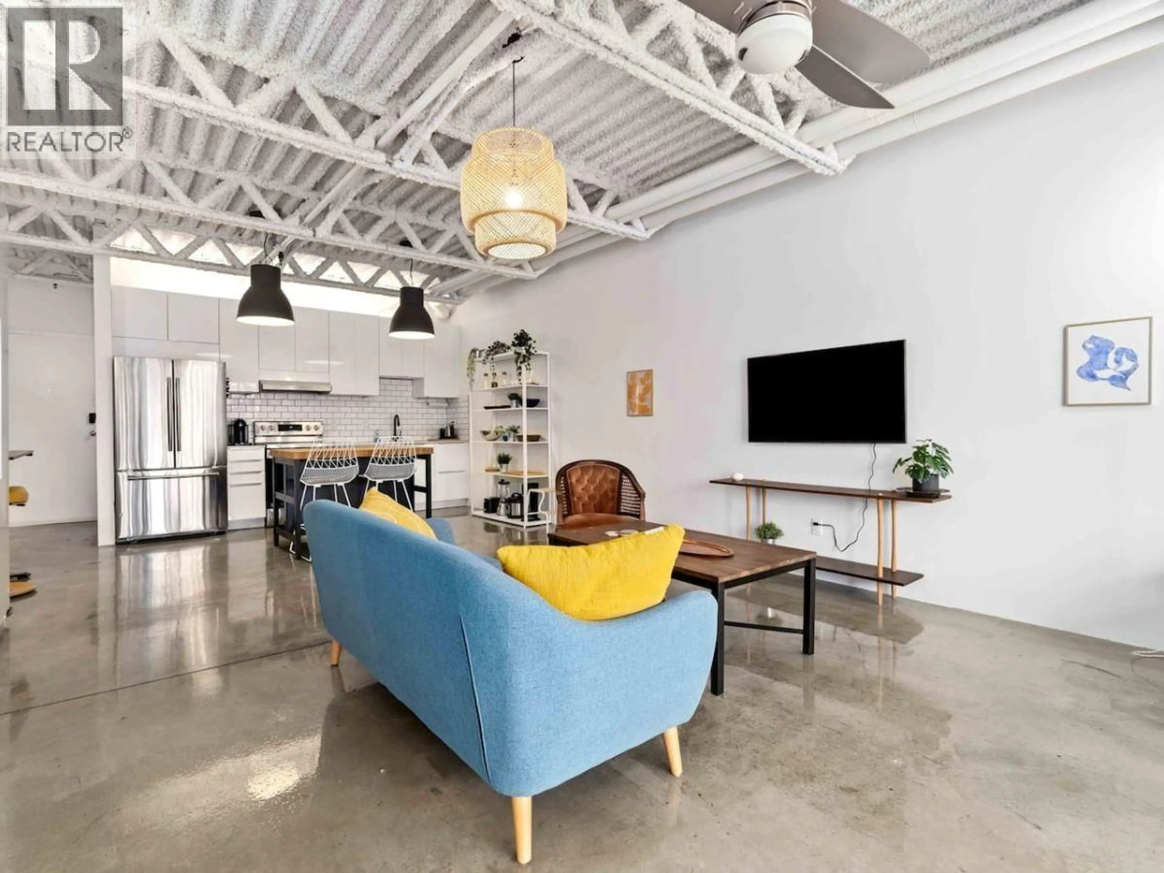 Living room with furniture, cement floor for 330 - 350 E 2ND AVENUE, Vancouver British Columbia V5T4R8