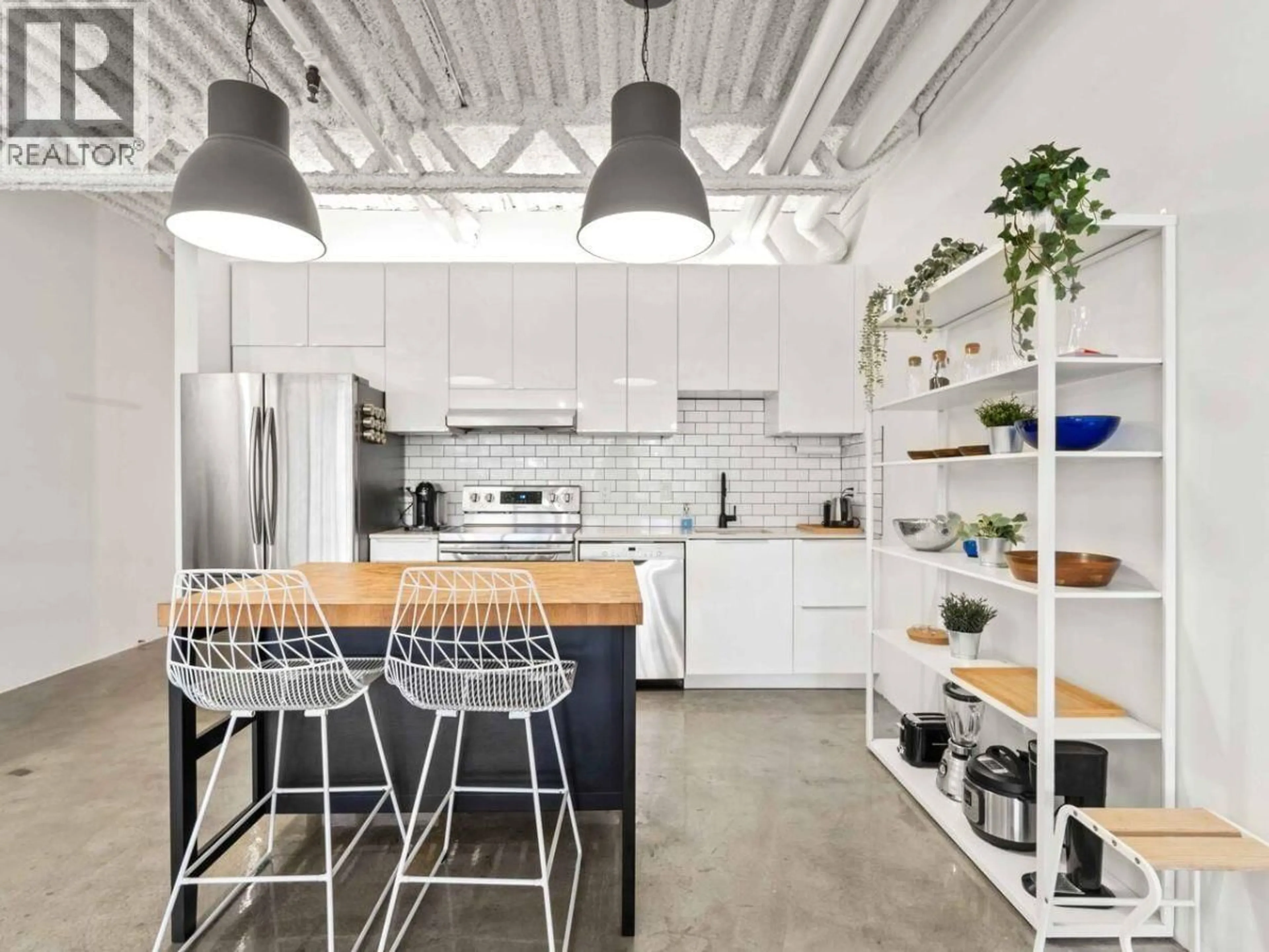 Open concept kitchen, cement floor for 330 - 350 E 2ND AVENUE, Vancouver British Columbia V5T4R8