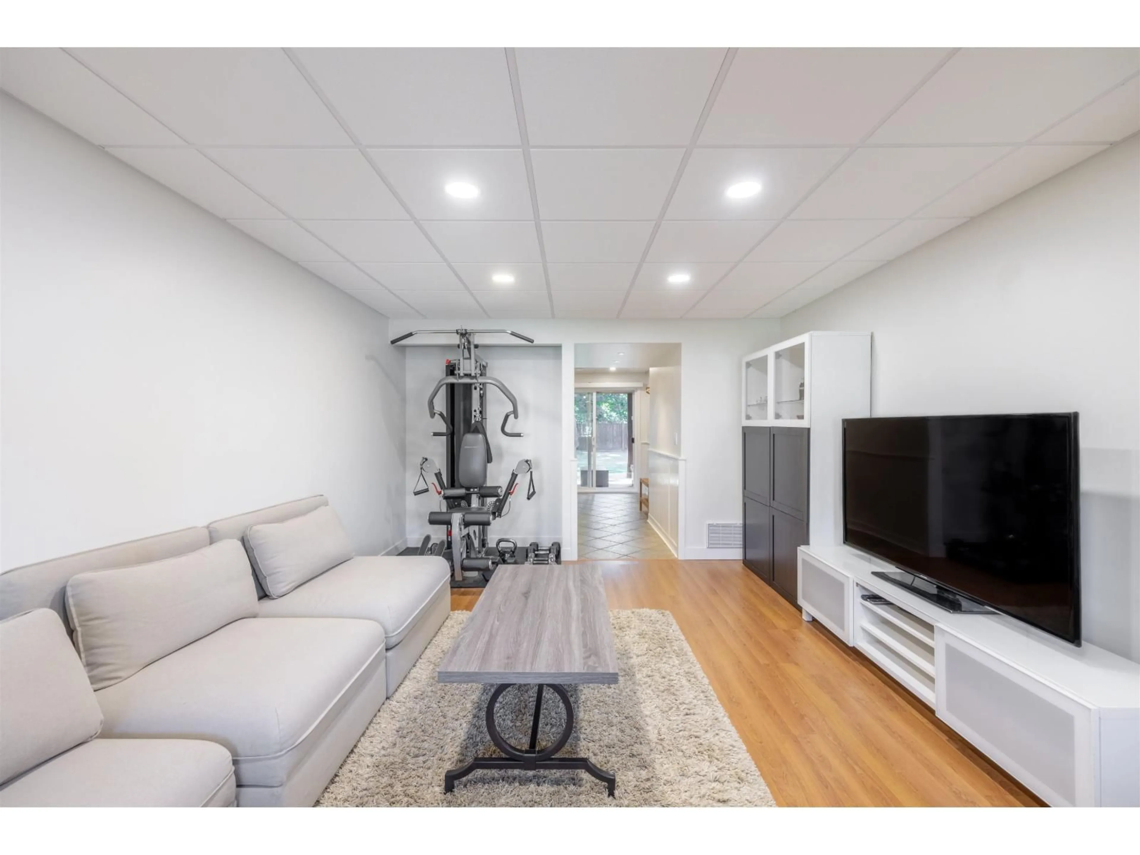 Living room with furniture, wood/laminate floor for 20978 92 AVENUE, Langley British Columbia V1M2B4