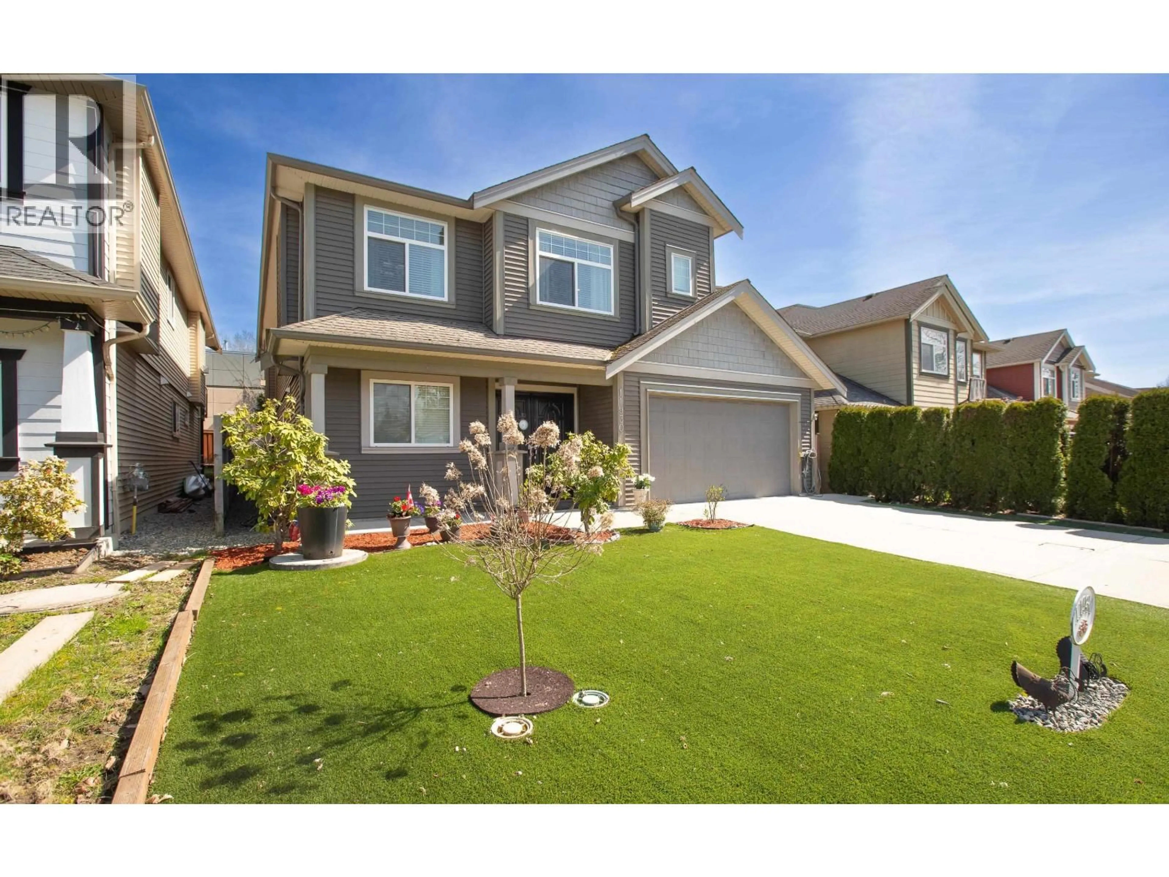 Home with vinyl exterior material, street for 11930 239TH STREET, Maple Ridge British Columbia V4R1W4