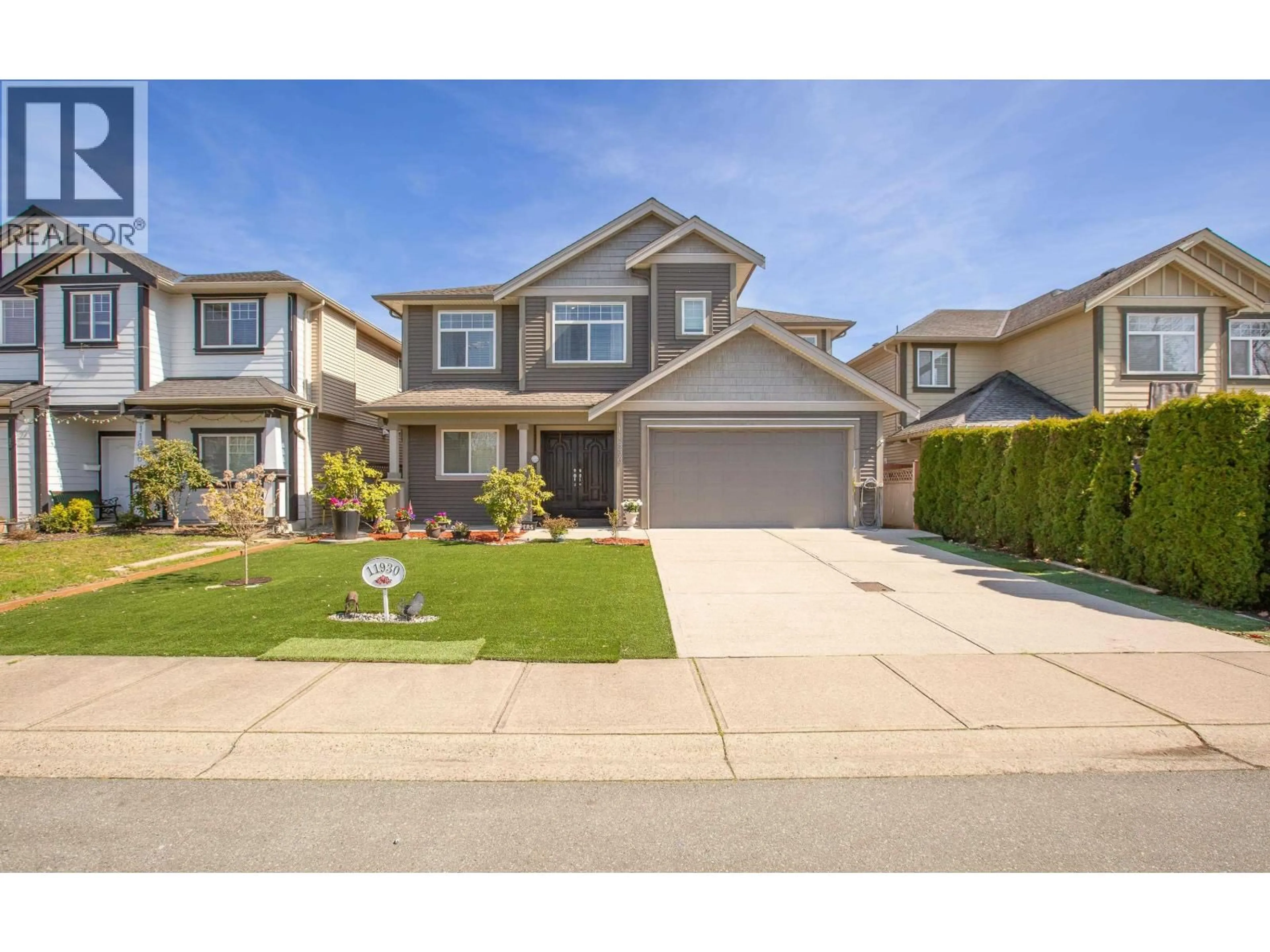 Home with vinyl exterior material, street for 11930 239TH STREET, Maple Ridge British Columbia V4R1W4