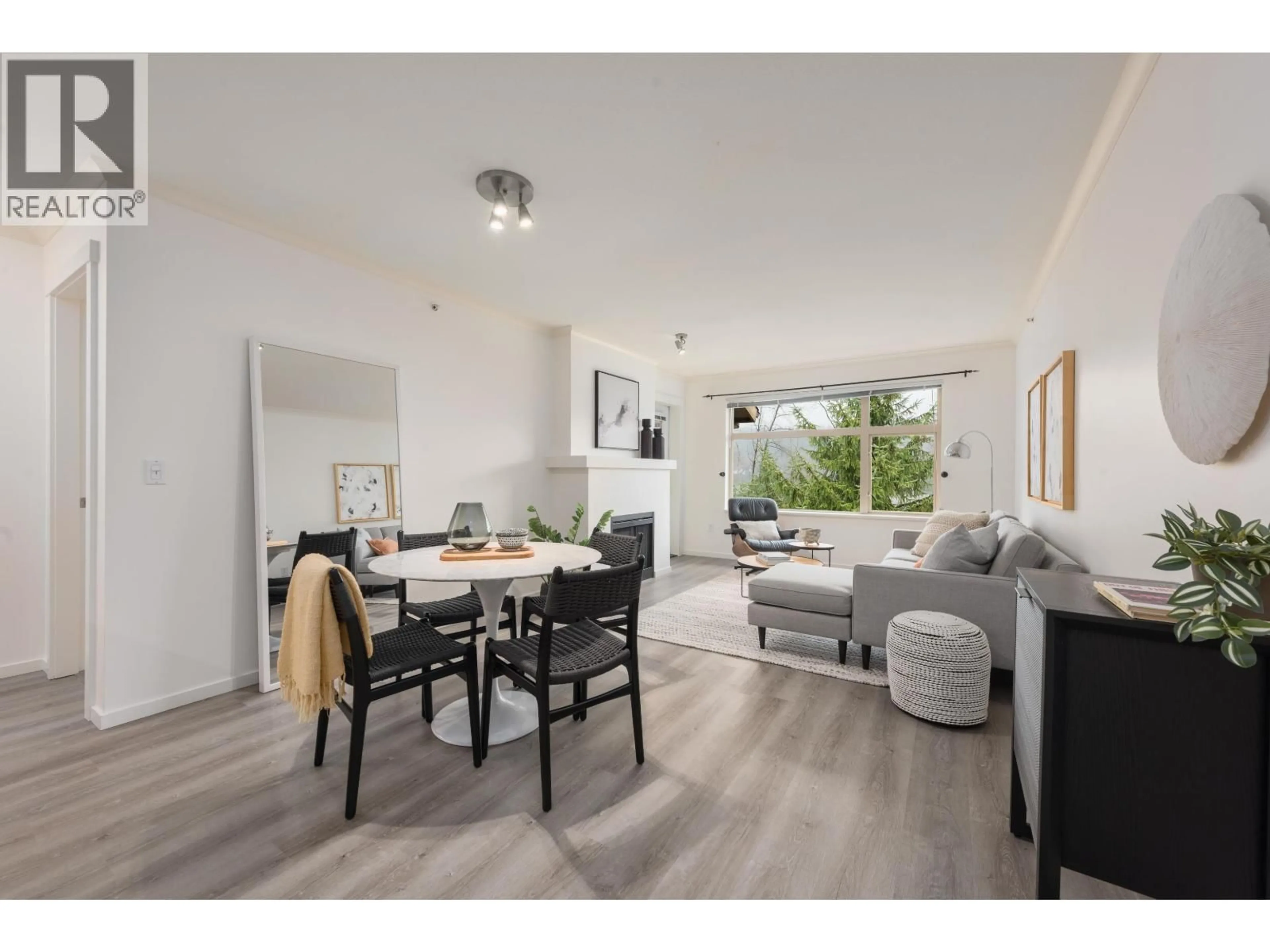 Living room with furniture, wood/laminate floor for 401 - 300 KLAHANIE DRIVE, Port Moody British Columbia V3H5K8