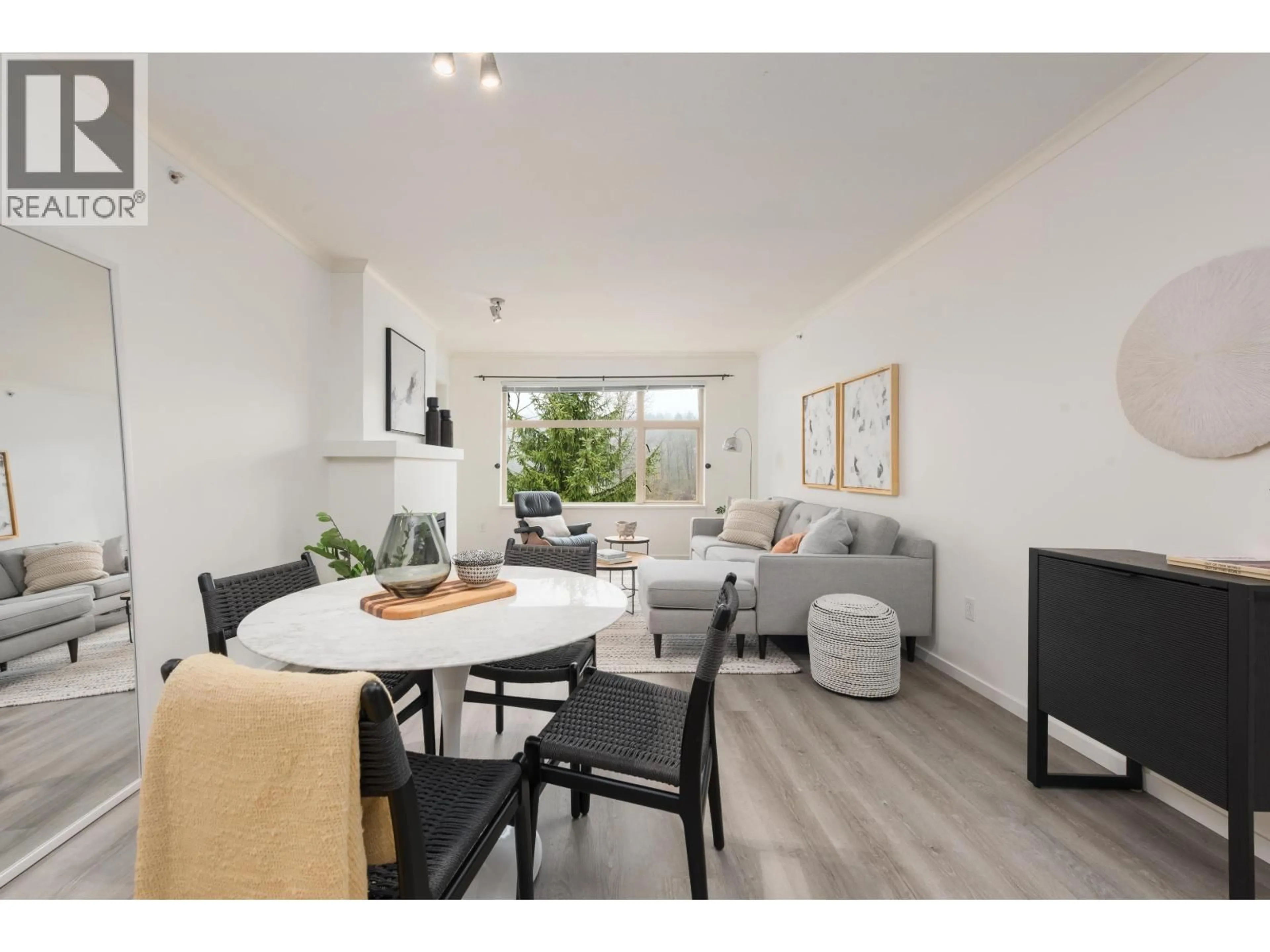 Living room with furniture, wood/laminate floor for 401 - 300 KLAHANIE DRIVE, Port Moody British Columbia V3H5K8