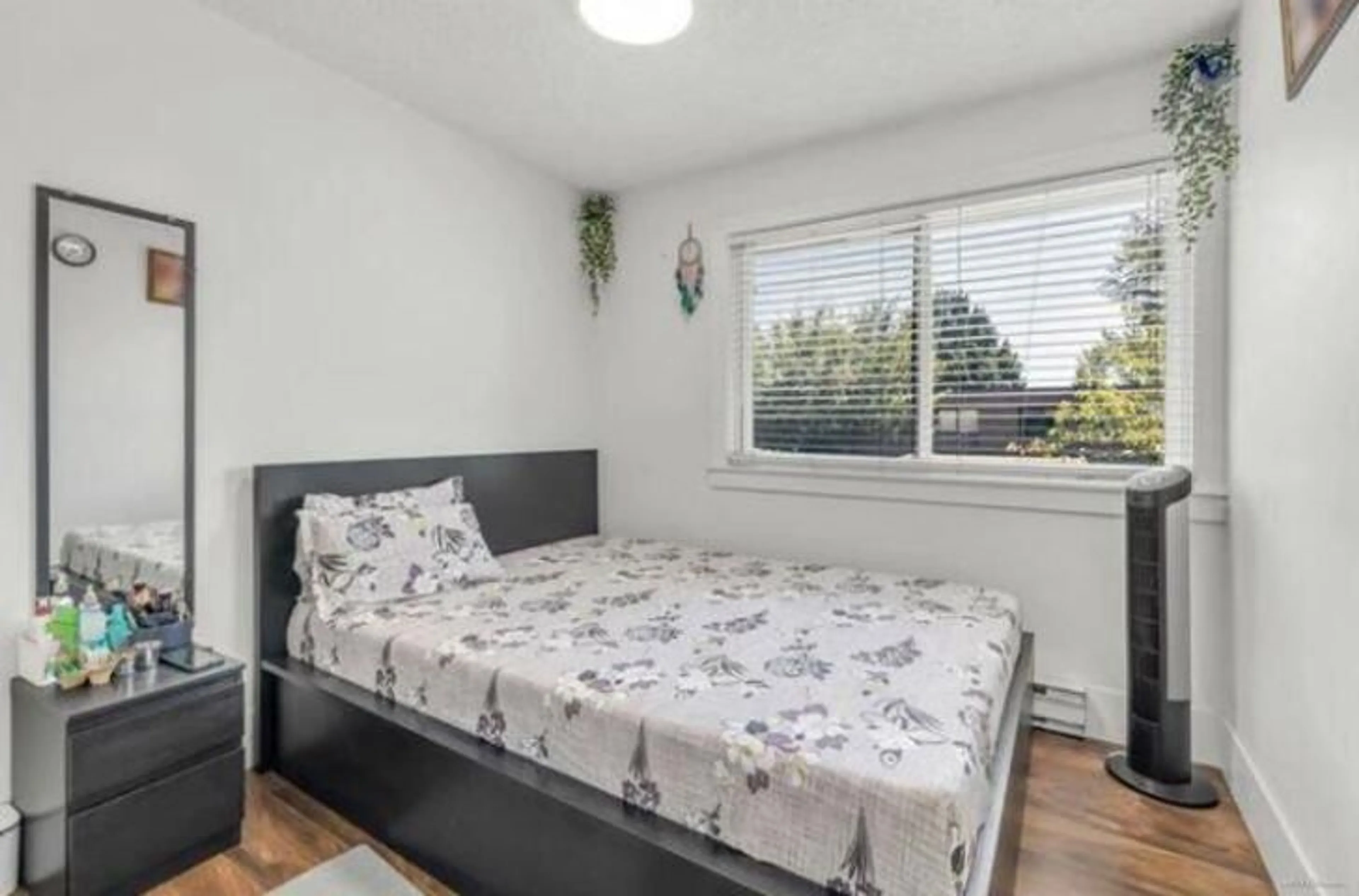 Bedroom with bed, wood/laminate floor for 256 - 9452 PRINCE CHARLES BOULEVARD, Surrey British Columbia V3V1S6