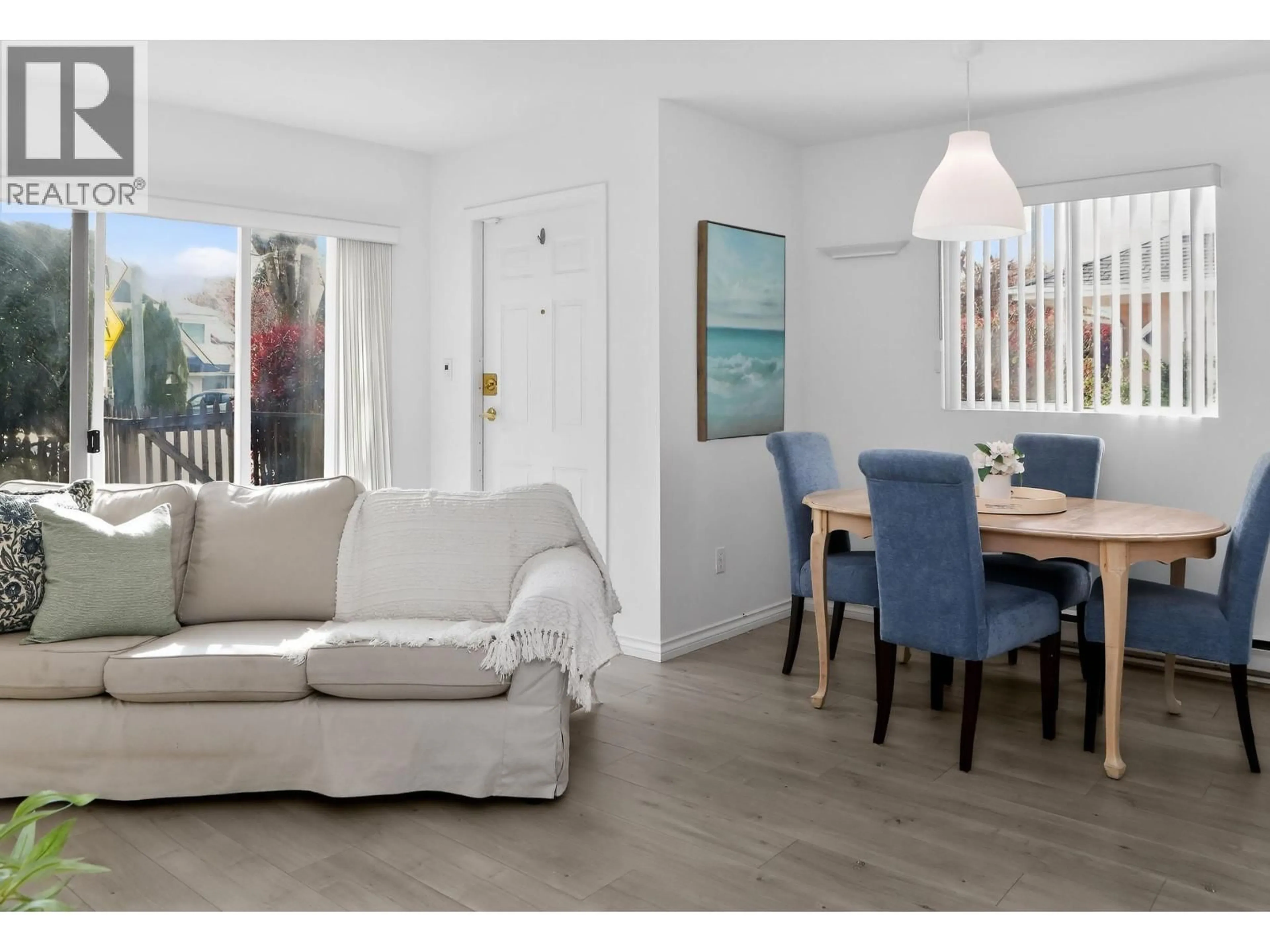 Living room with furniture, wood/laminate floor for 109 - 2211 NO. 4 ROAD, Richmond British Columbia V6X3X1