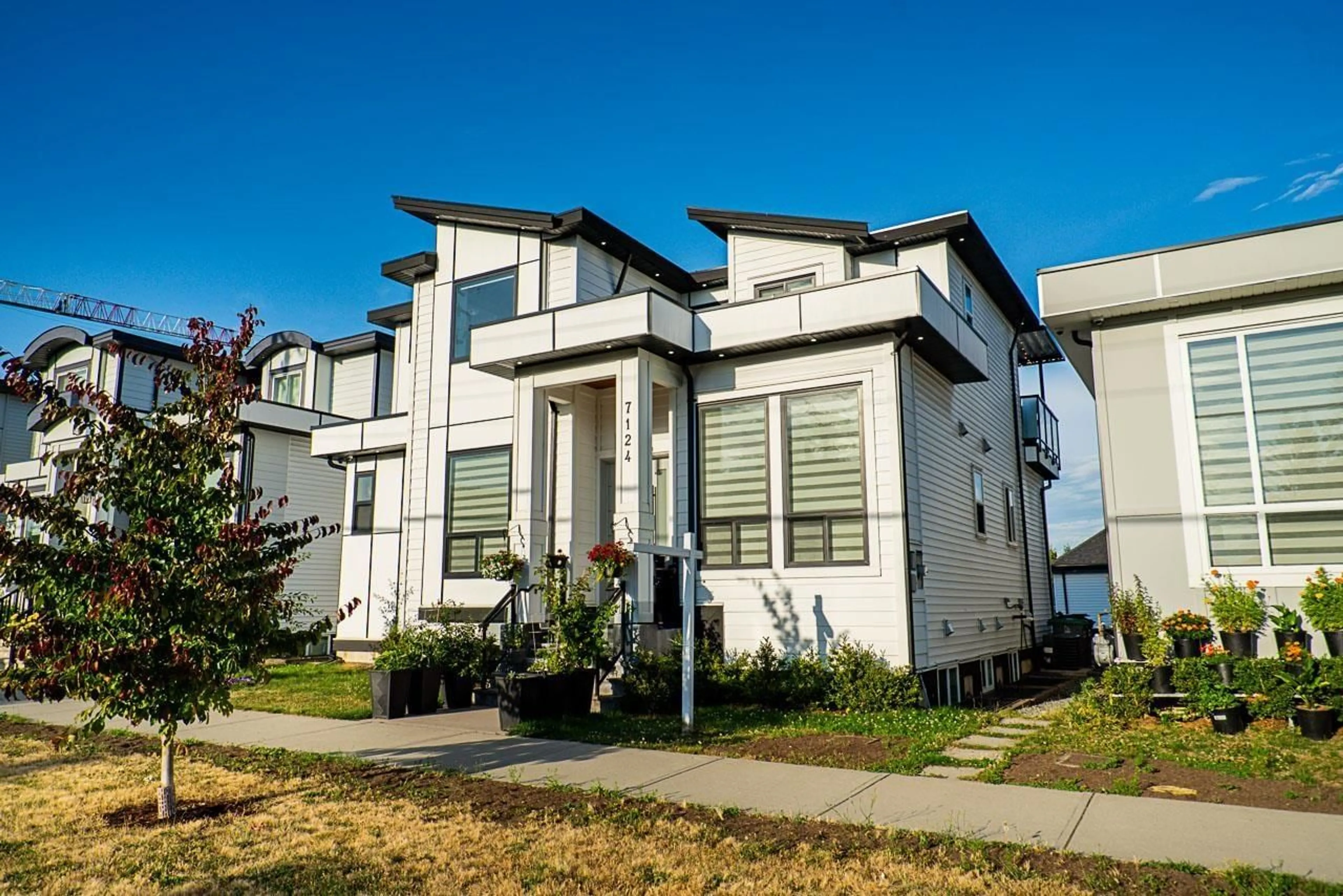 Home with vinyl exterior material, street for 7124 192 STREET, Surrey British Columbia V4N6Y1