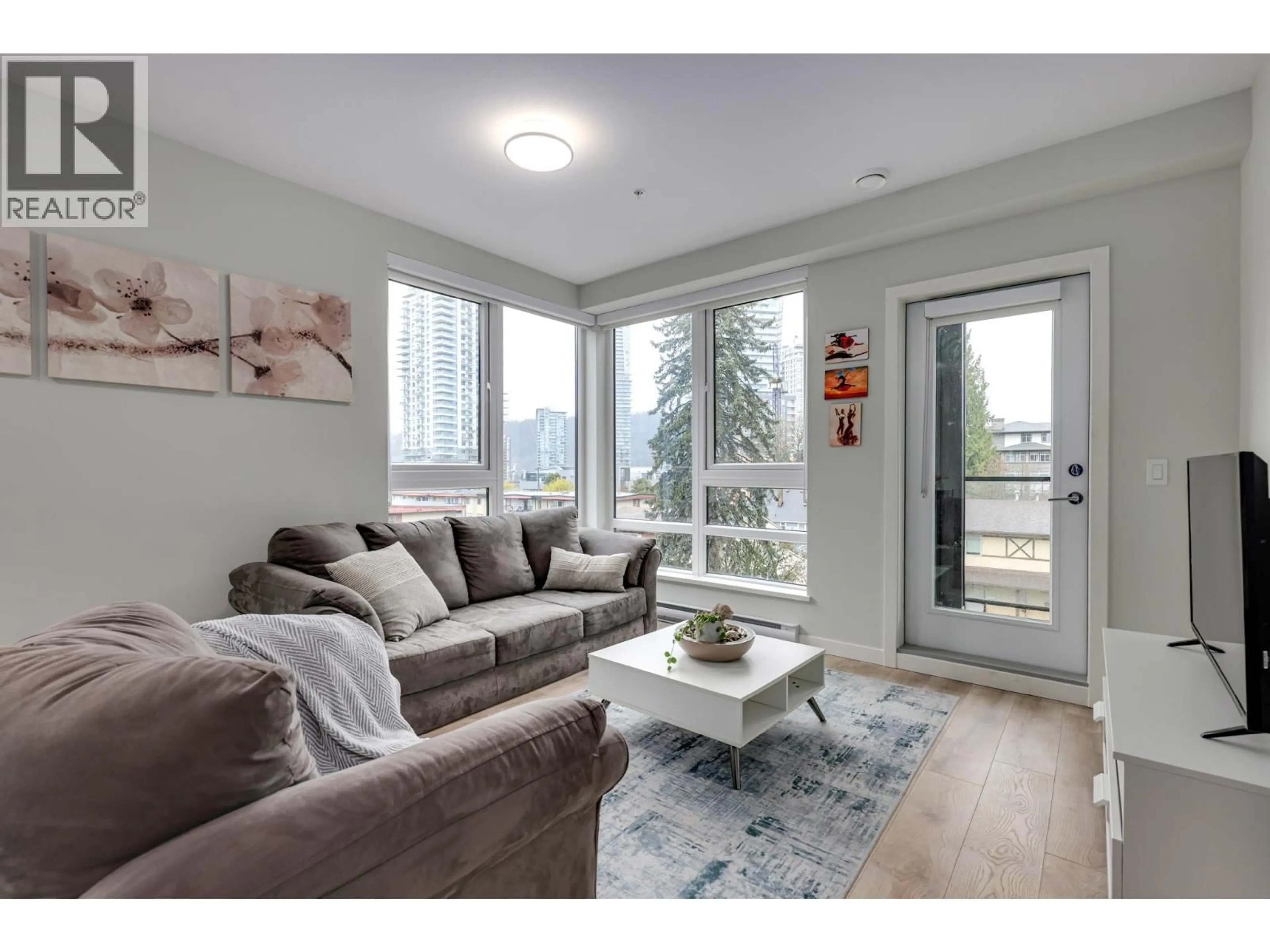 Living room with furniture, wood/laminate floor for 404 - 615 COTTONWOOD AVENUE, Coquitlam British Columbia V3J2S5
