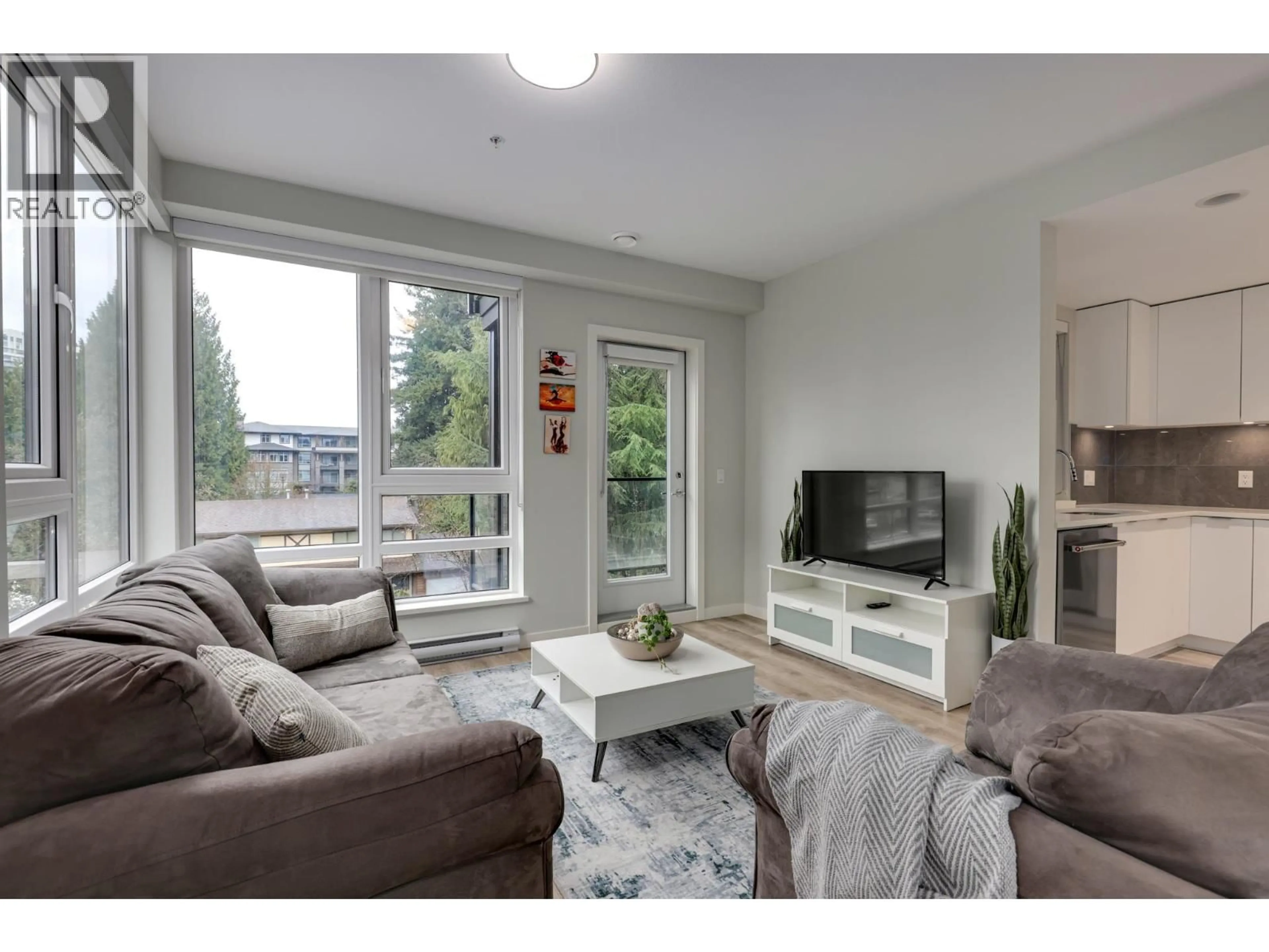 Living room with furniture, wood/laminate floor for 404 - 615 COTTONWOOD AVENUE, Coquitlam British Columbia V3J2S5