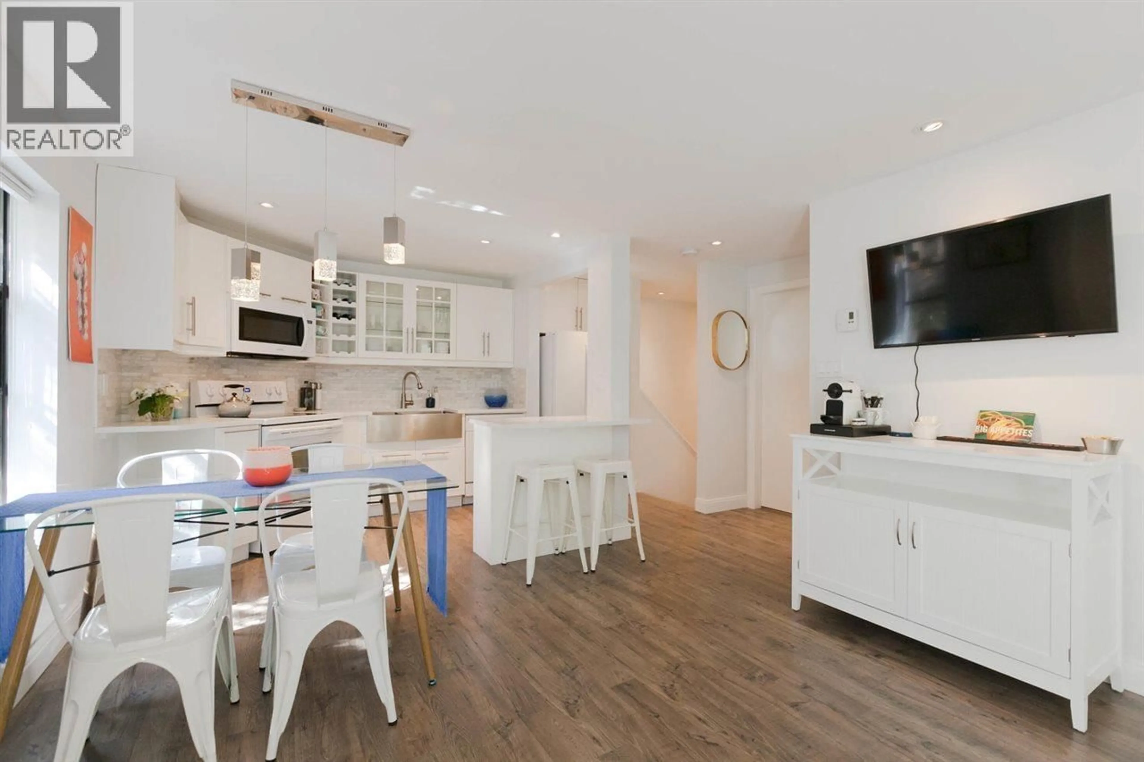 Open concept kitchen, wood/laminate floor for 104 - 936 BUTE STREET, Vancouver British Columbia V6E1Y8