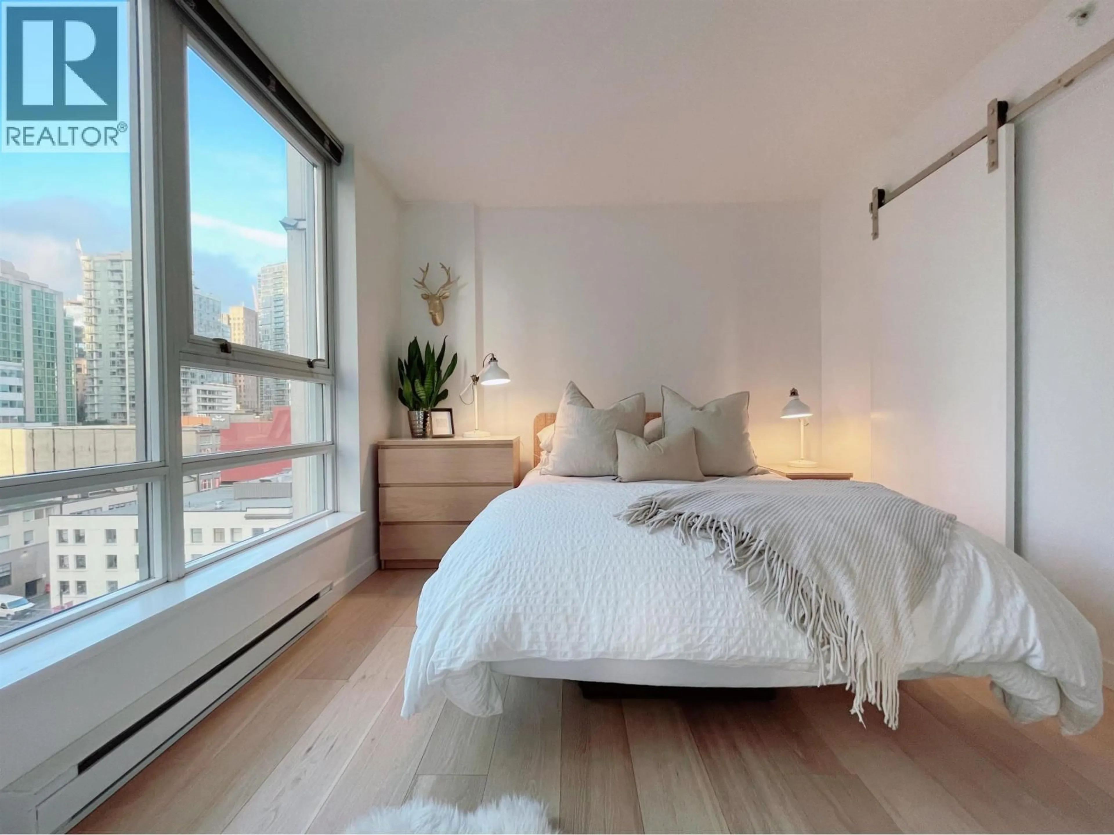 Bedroom with bed, wood/laminate floor for 1110 - 928 BEATTY STREET, Vancouver British Columbia V6Z3G6