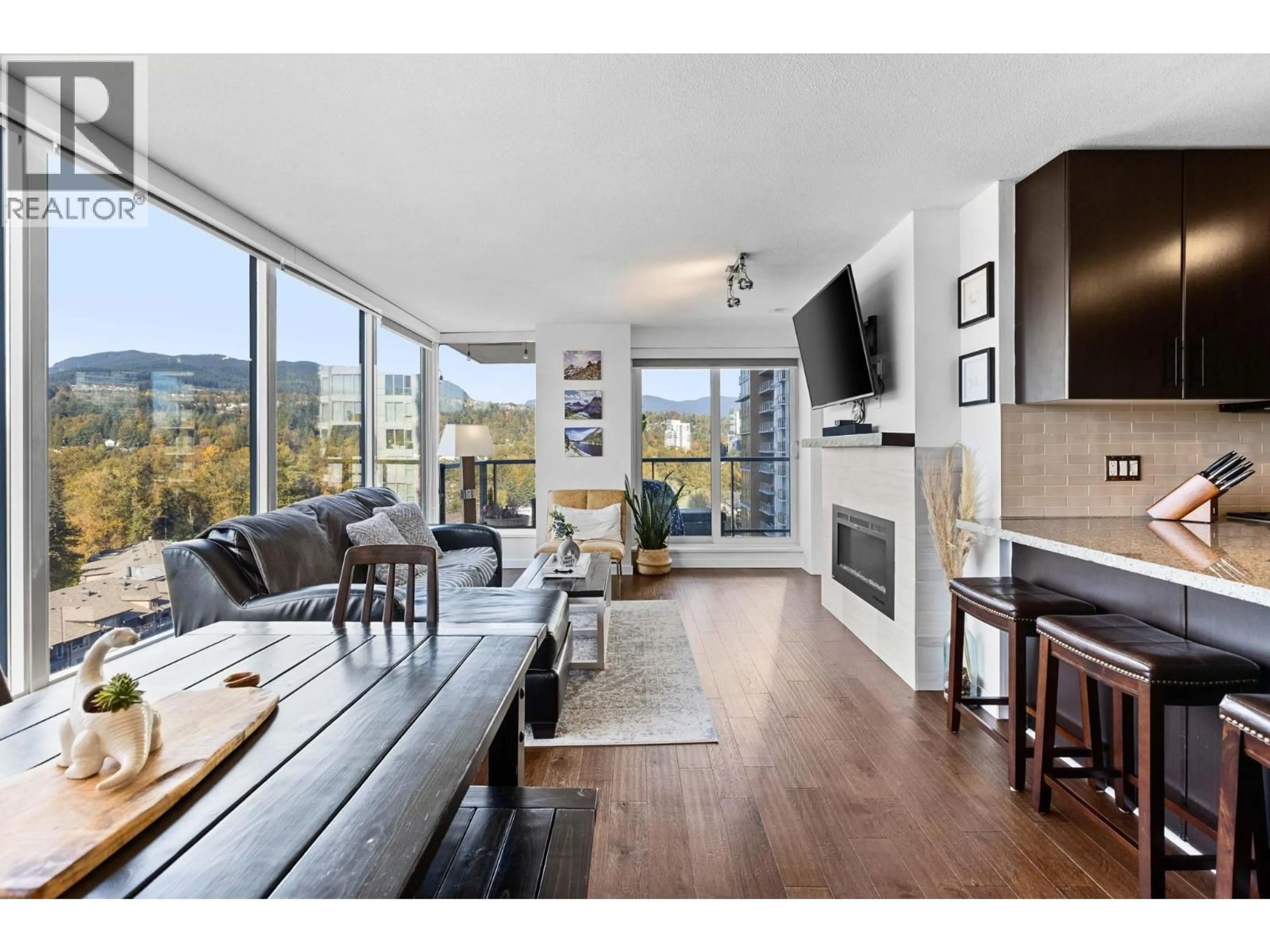 Living room with furniture, wood/laminate floor for 1606 - 651 NOOTKA WAY, Port Moody British Columbia V3H0A1