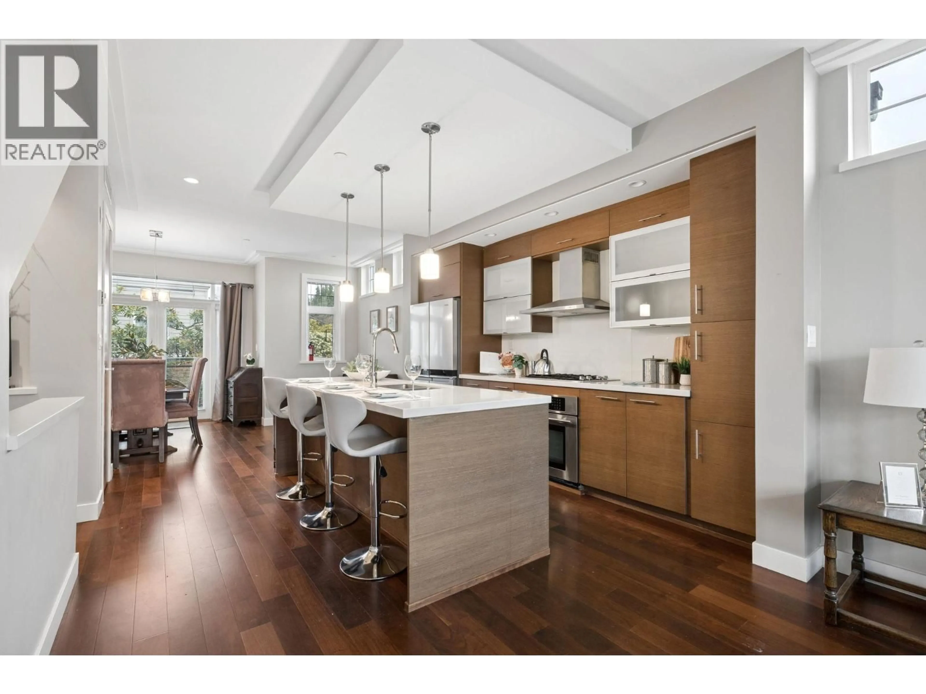 Open concept kitchen, wood/laminate floor for 5423 WILLOW STREET, Vancouver British Columbia V5Z3S3