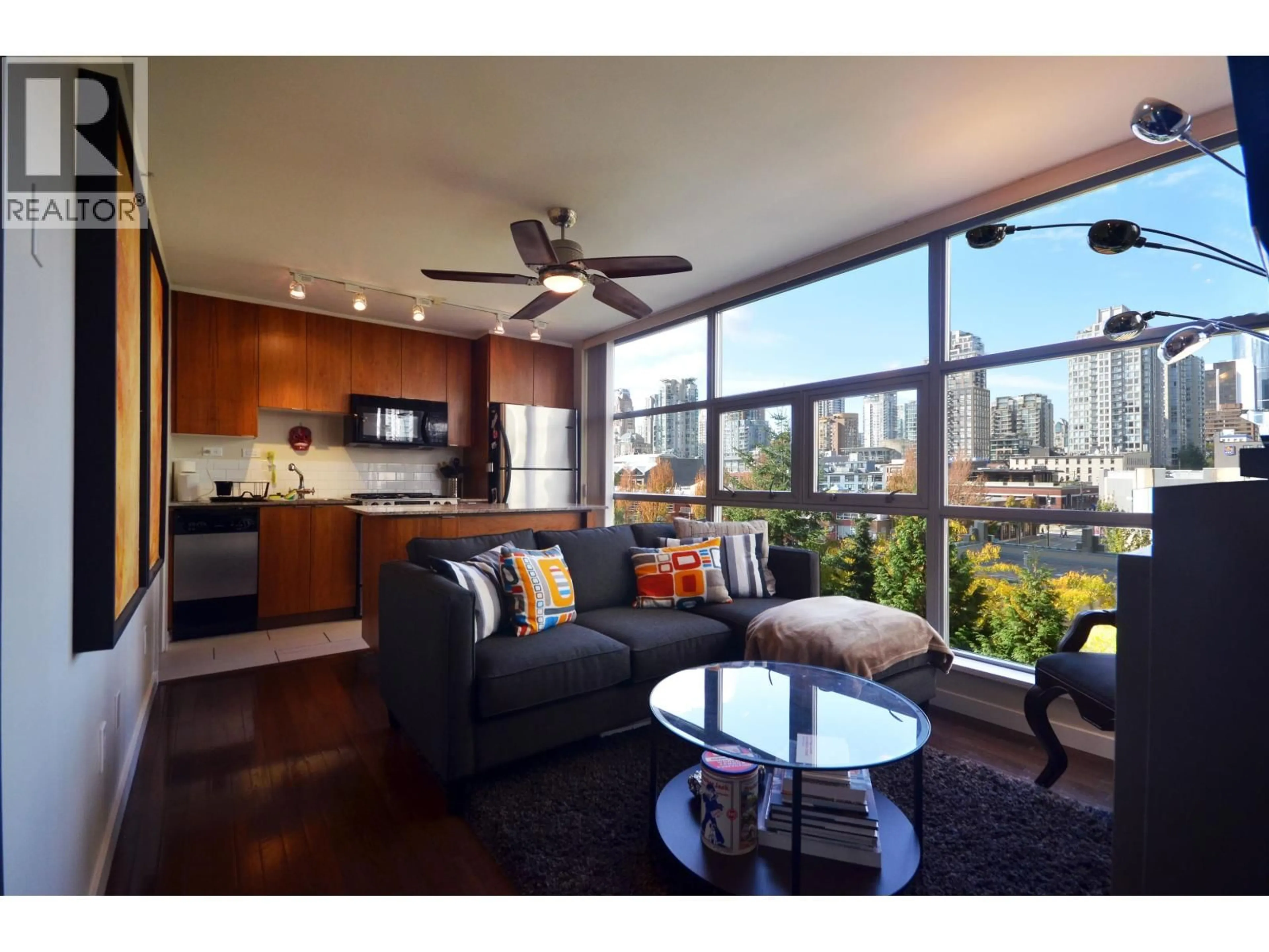 Living room with furniture, wood/laminate floor for 601 - 989 BEATTY STREET, Vancouver British Columbia V6Z3C2