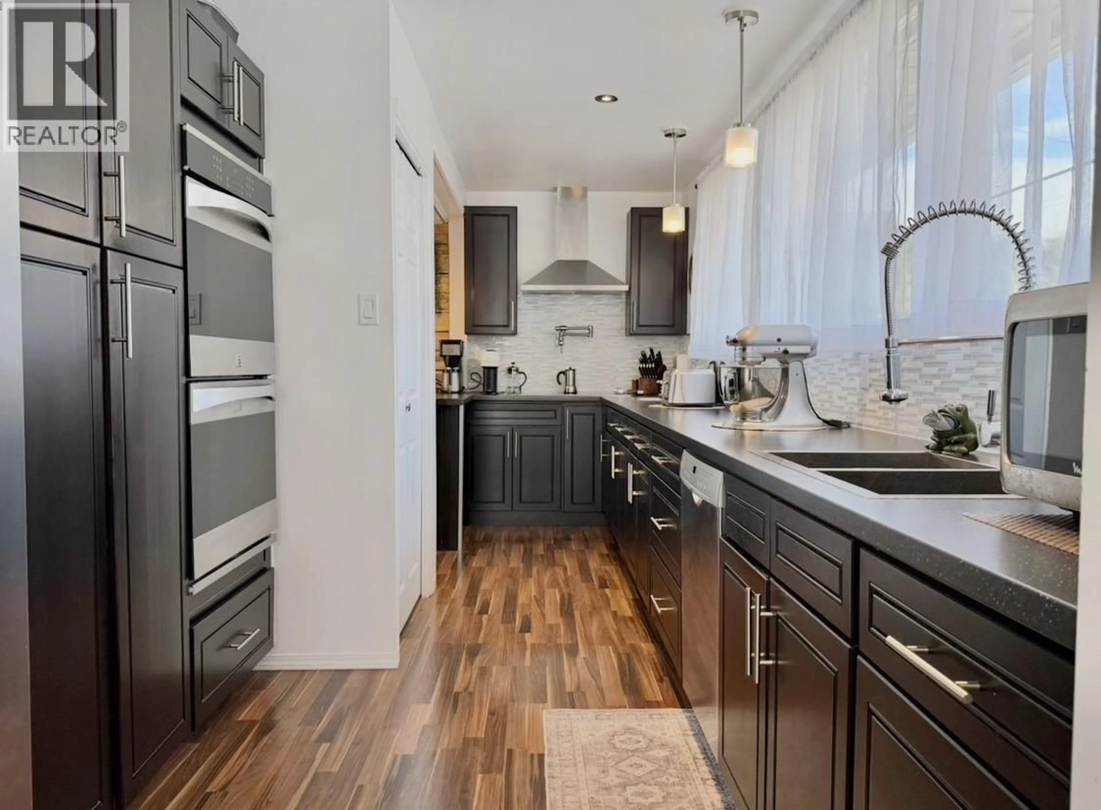 Contemporary kitchen, wood/laminate floor for 19 SWALLOW STREET, Kitimat British Columbia V8C1K6