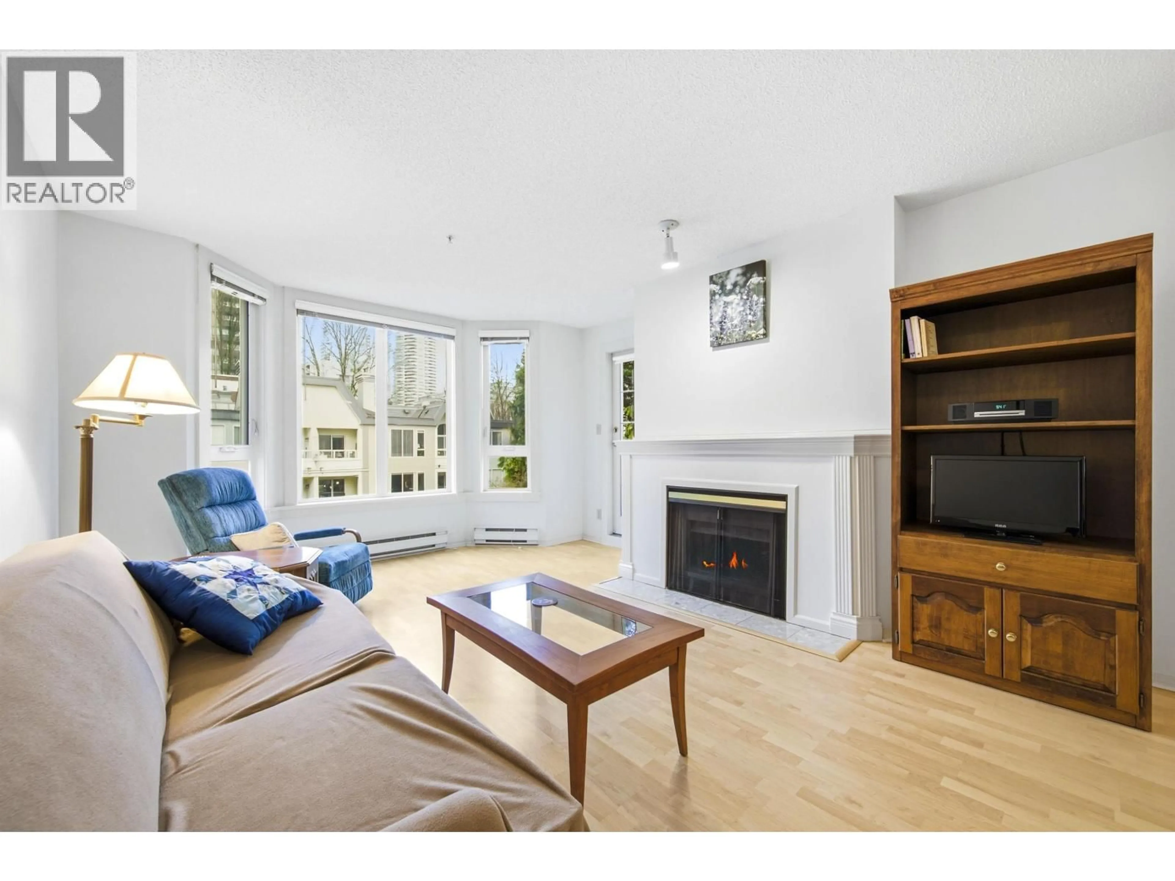 Living room with furniture, wood/laminate floor for 412 - 1230 HARO STREET, Vancouver British Columbia V6E4J9