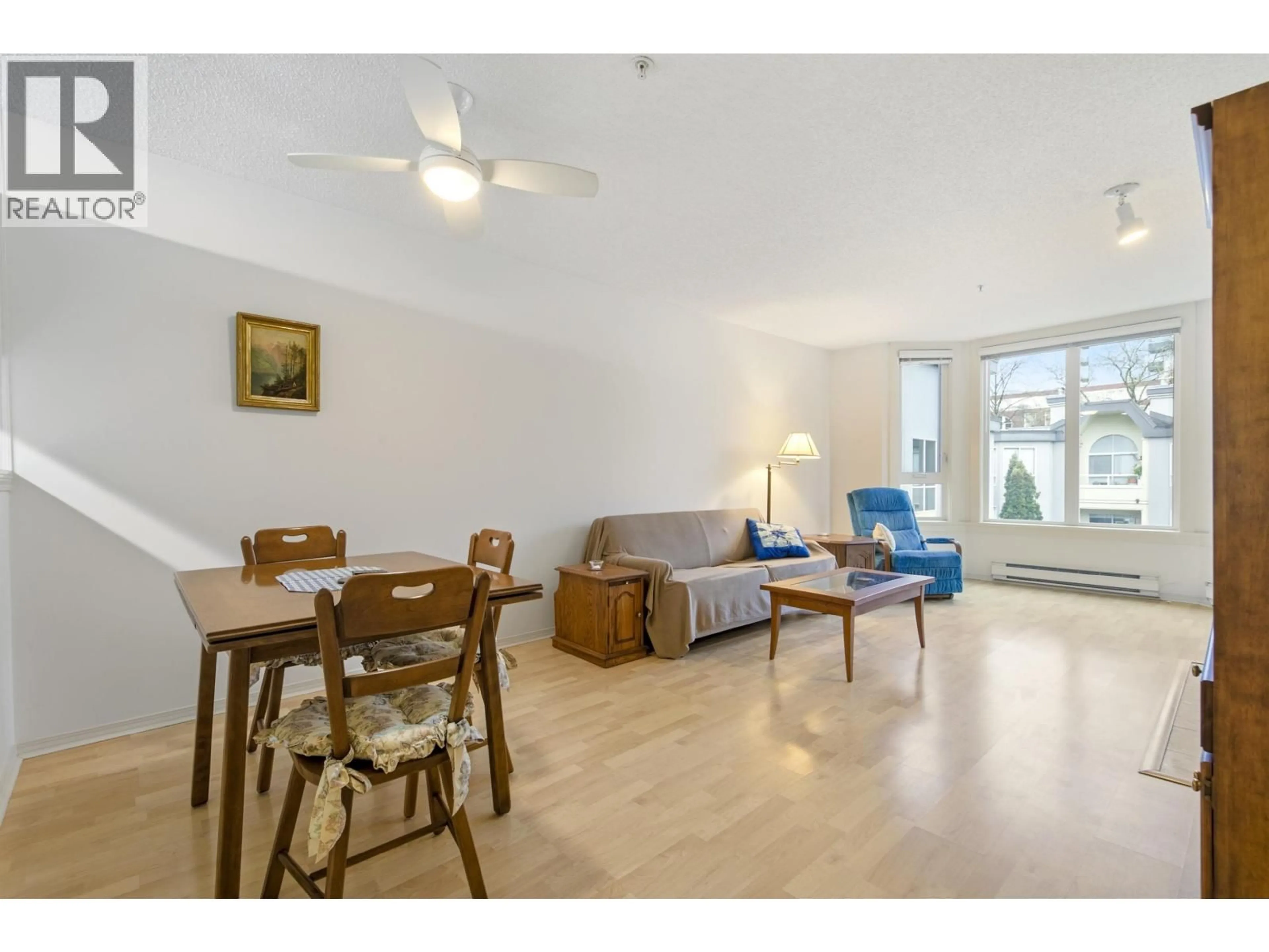 Living room with furniture, wood/laminate floor for 412 - 1230 HARO STREET, Vancouver British Columbia V6E4J9