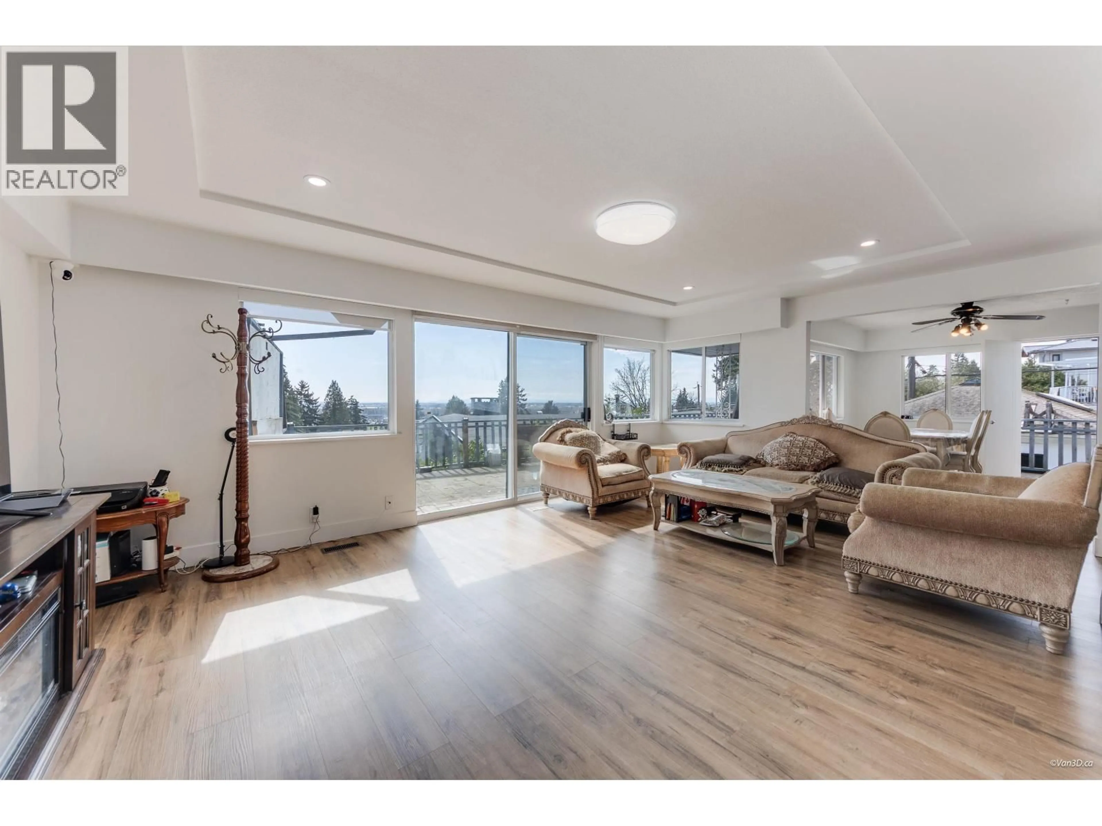 Living room with furniture, wood/laminate floor for 8035 NELSON AVENUE, Burnaby British Columbia V5J4E6