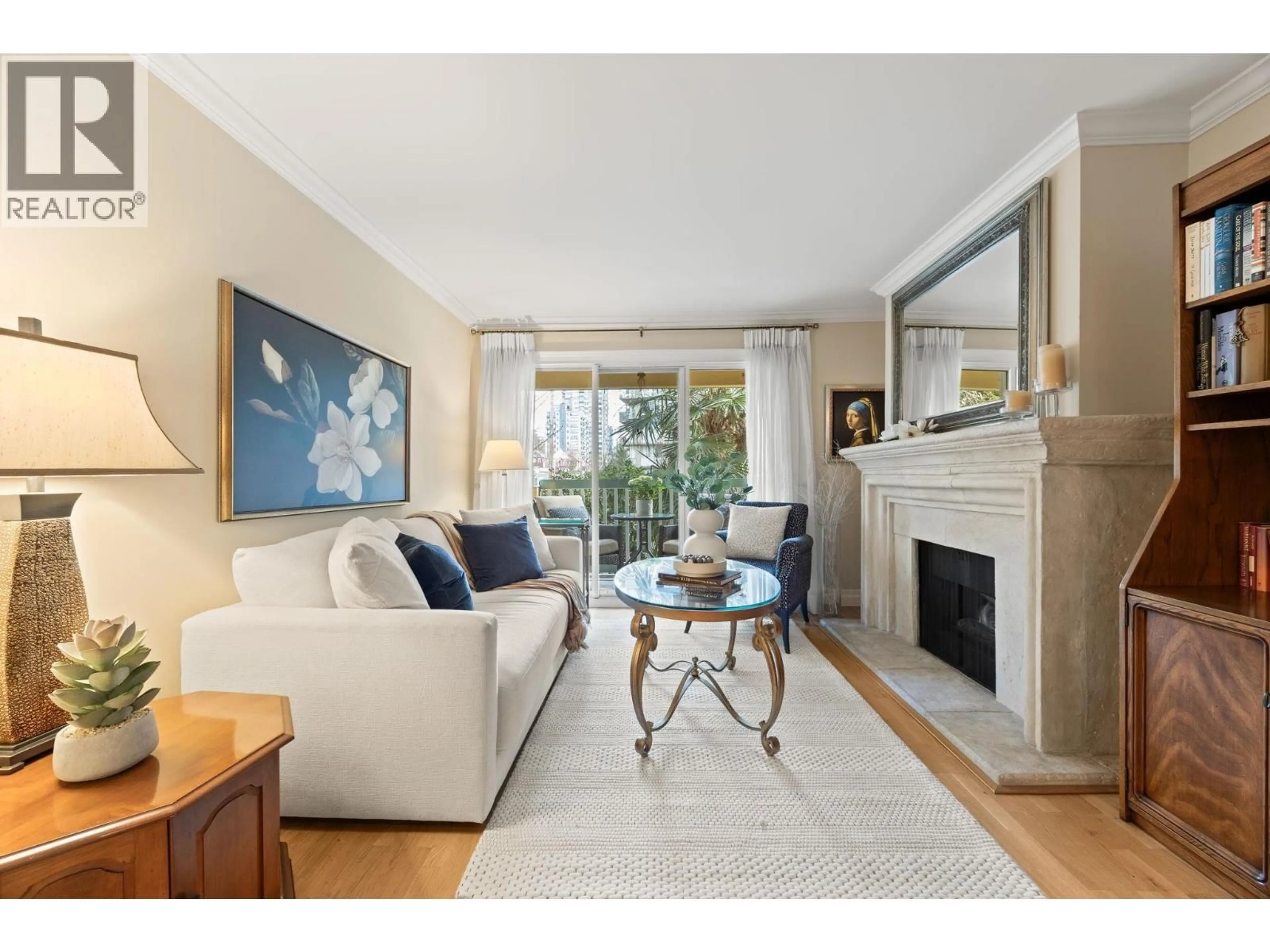 Living room with furniture, wood/laminate floor for 203 - 1125 GILFORD STREET, Vancouver British Columbia V6G2P7