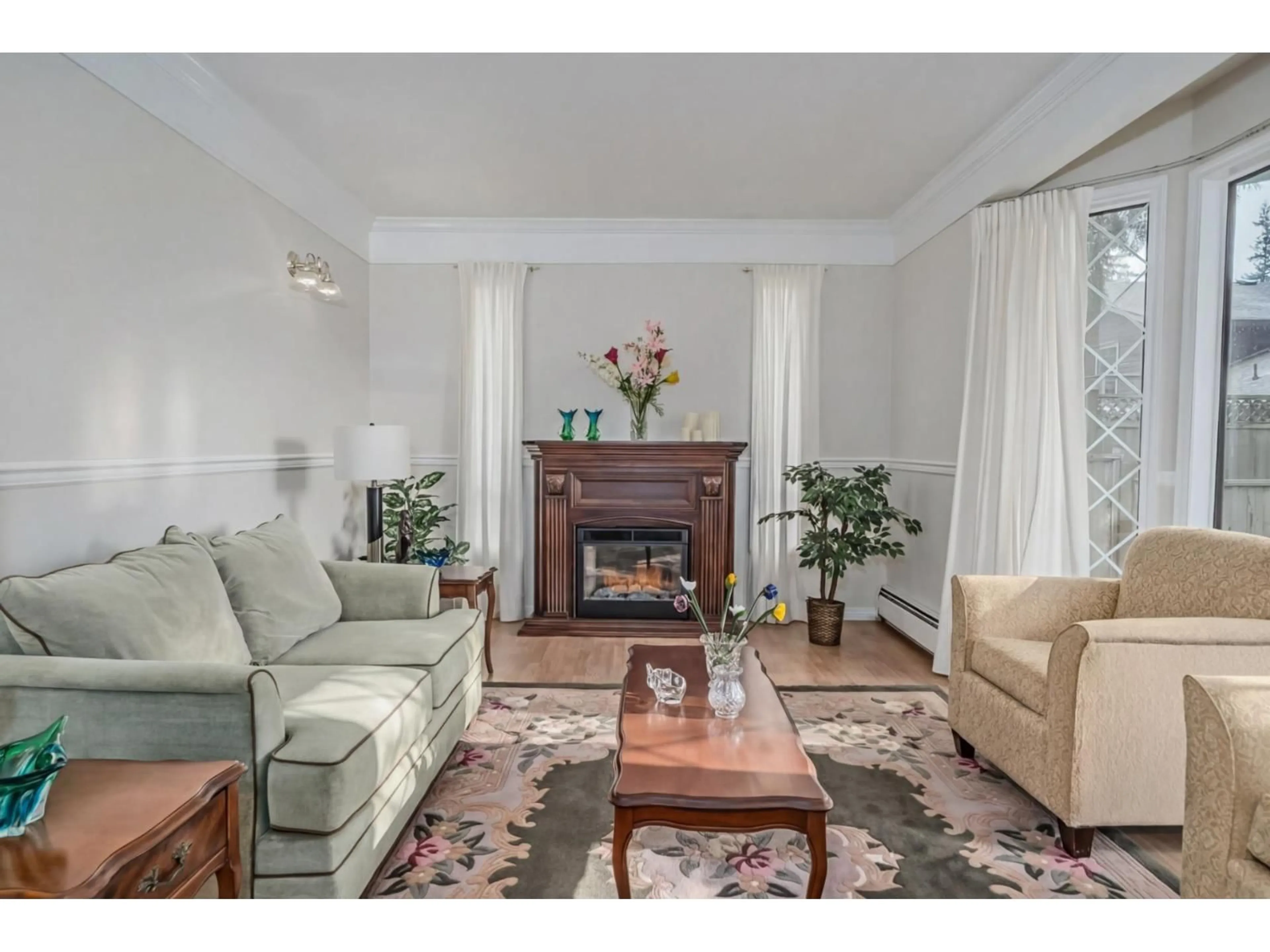 Living room with furniture, wood/laminate floor for 4257 199A STREET, Langley British Columbia V3A4V5