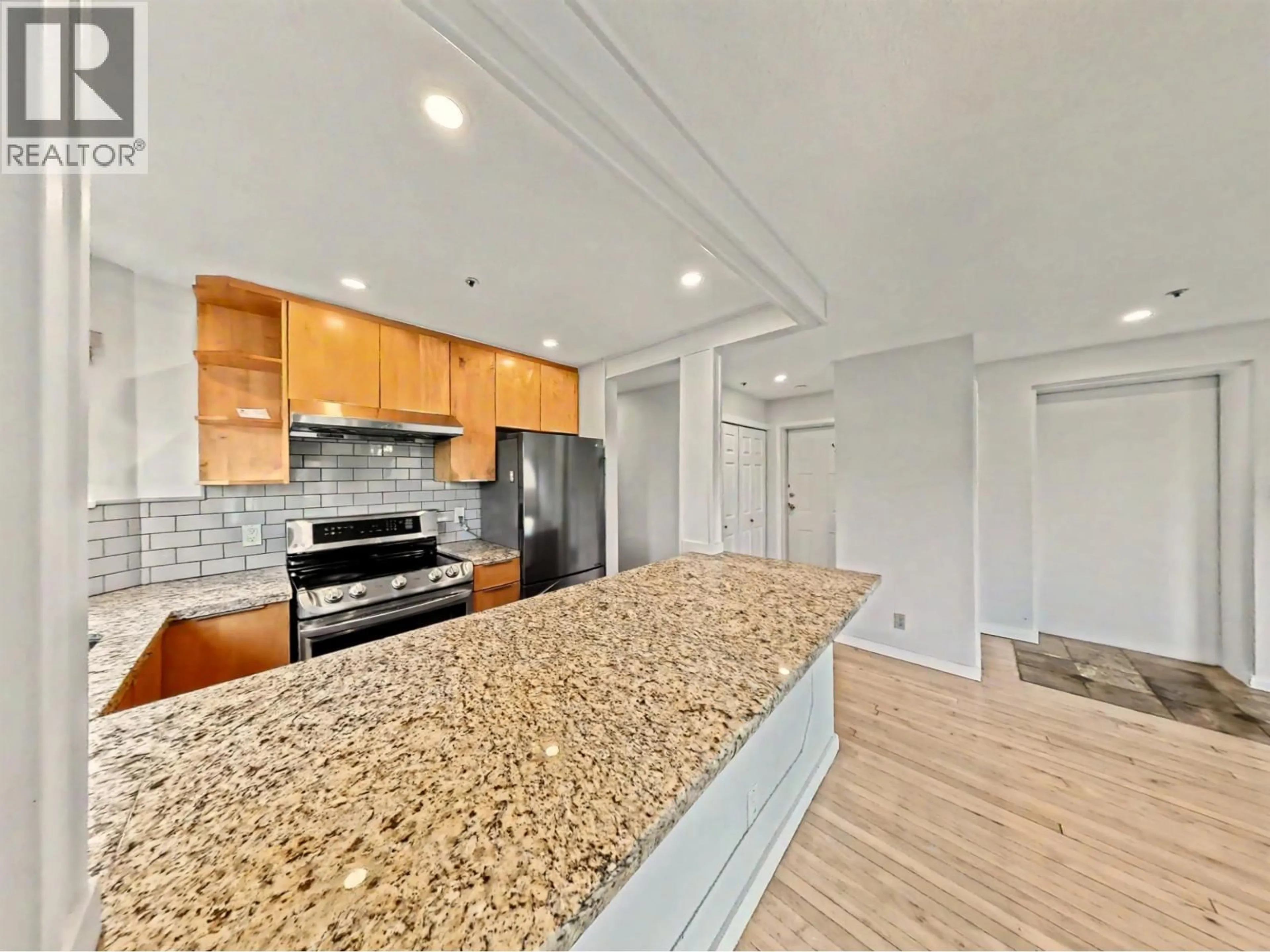 Open concept kitchen, ceramic/tile floor for 201 - 1868 8TH AVENUE, Vancouver British Columbia V6J5G3