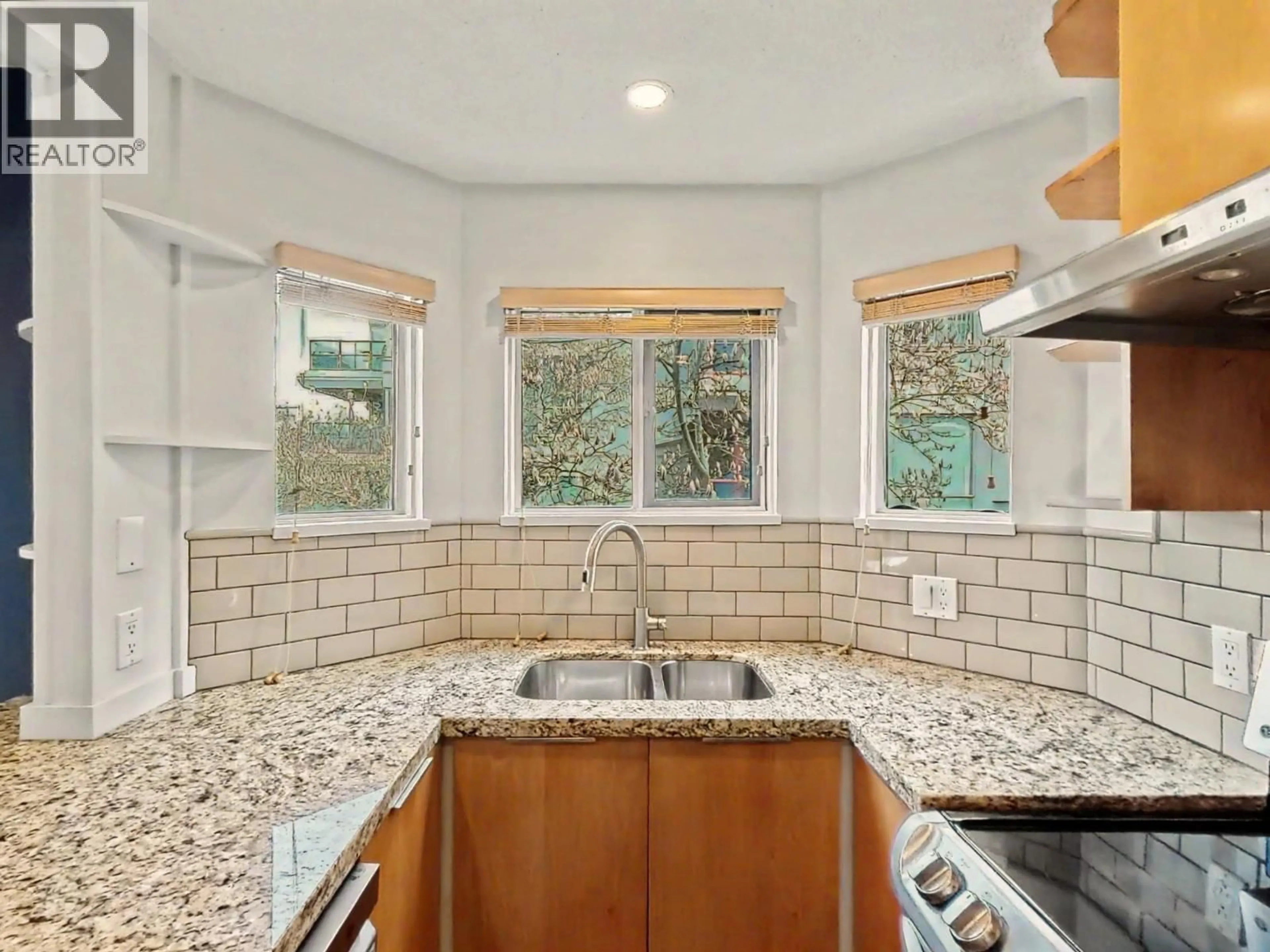 Open concept kitchen, ceramic/tile floor for 201 - 1868 8TH AVENUE, Vancouver British Columbia V6J5G3