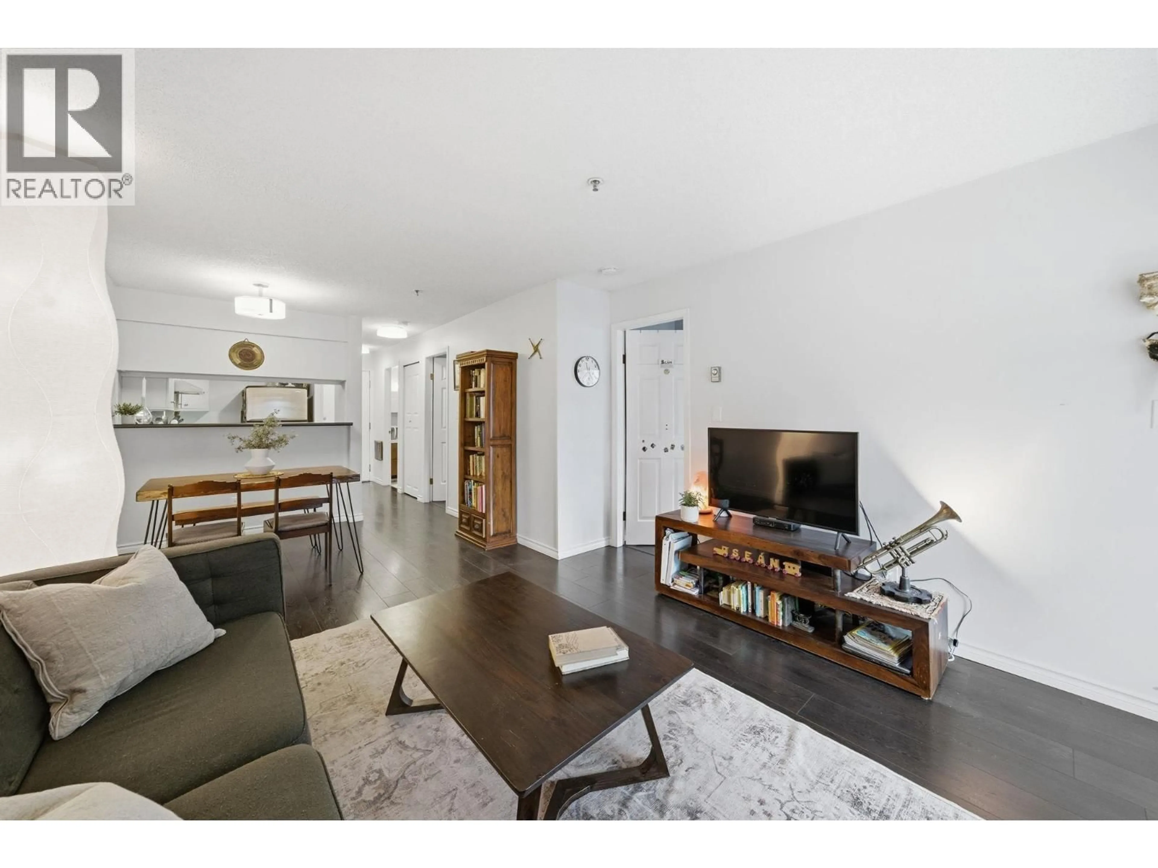 Living room with furniture, wood/laminate floor for 203 - 555 8TH AVENUE, Vancouver British Columbia V5T1S9