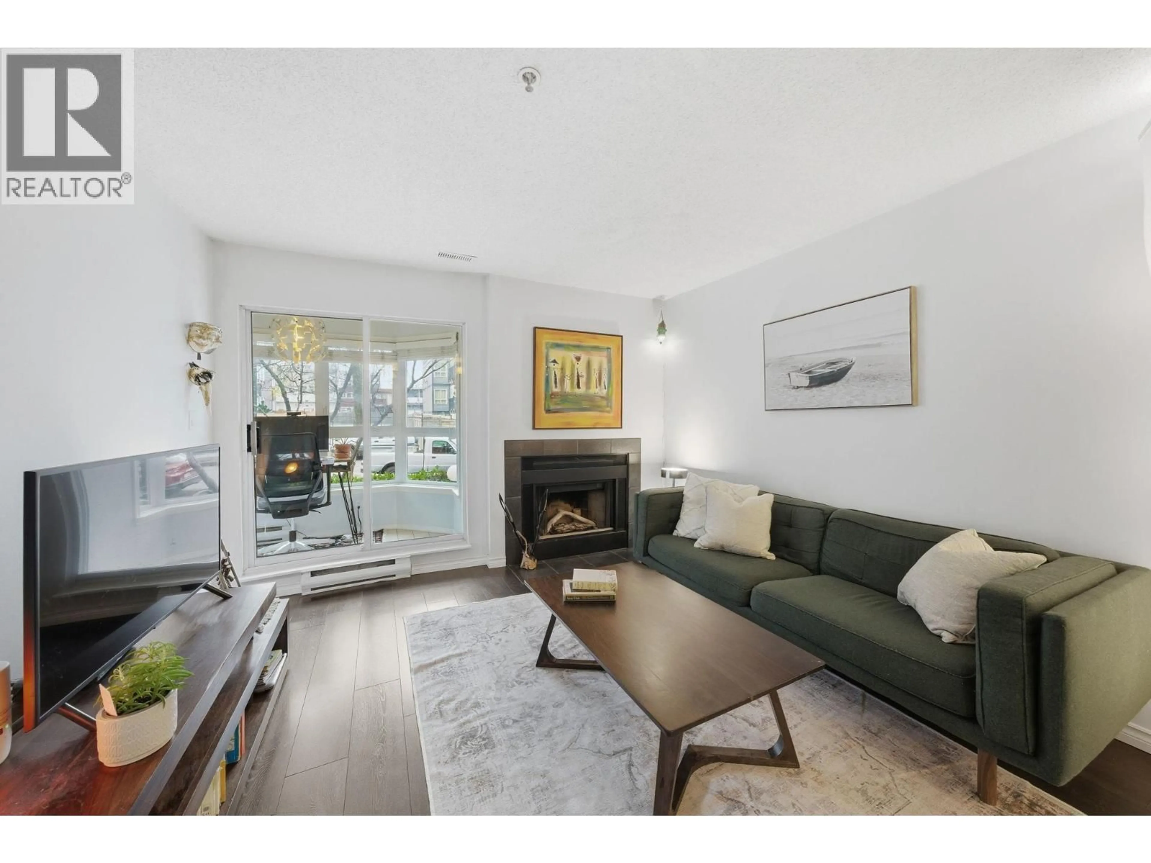 Living room with furniture, wood/laminate floor for 203 - 555 8TH AVENUE, Vancouver British Columbia V5T1S9