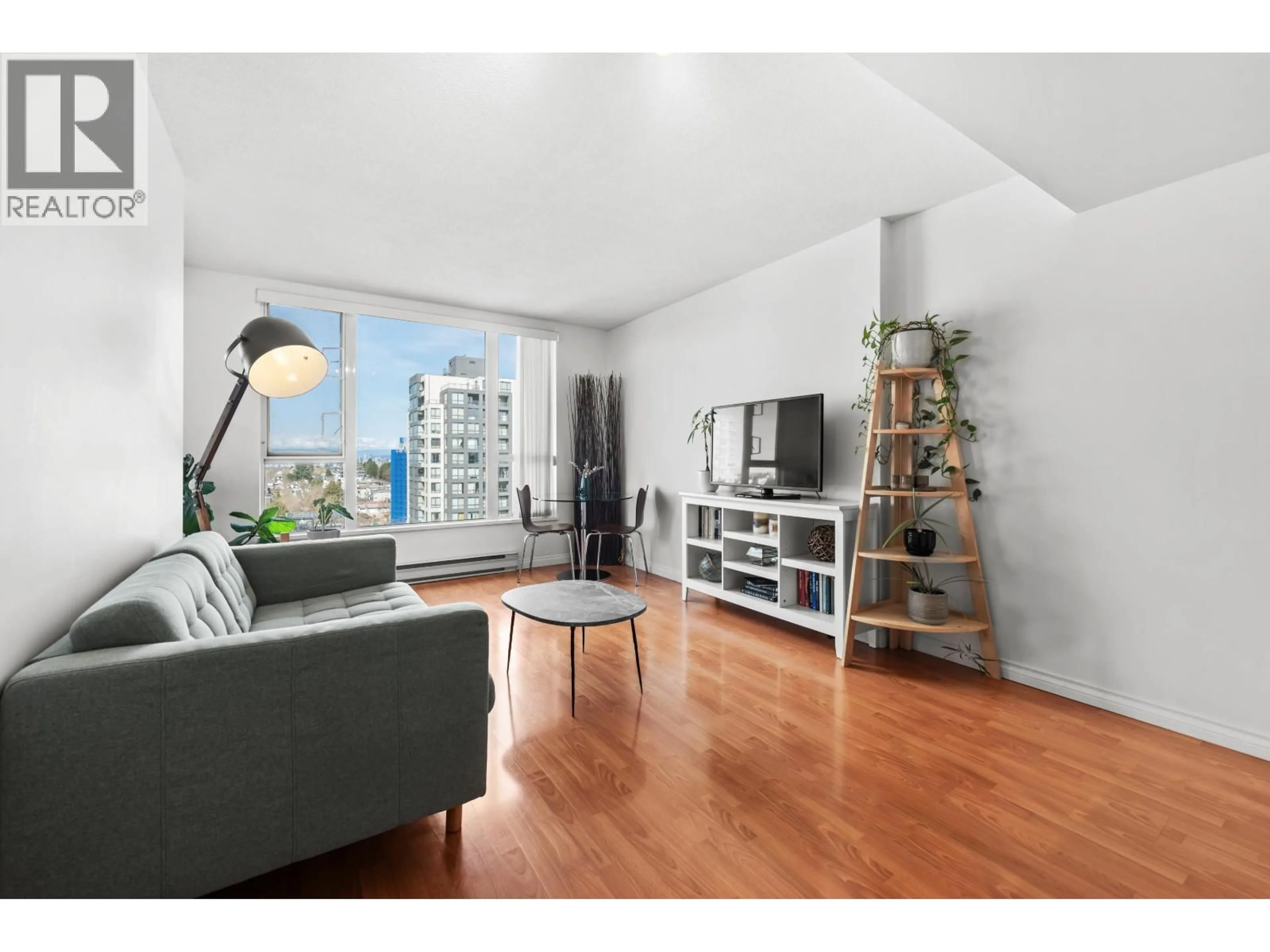 Living room with furniture, wood/laminate floor for 1205 - 5189 GASTON STREET, Vancouver British Columbia V5R6C7