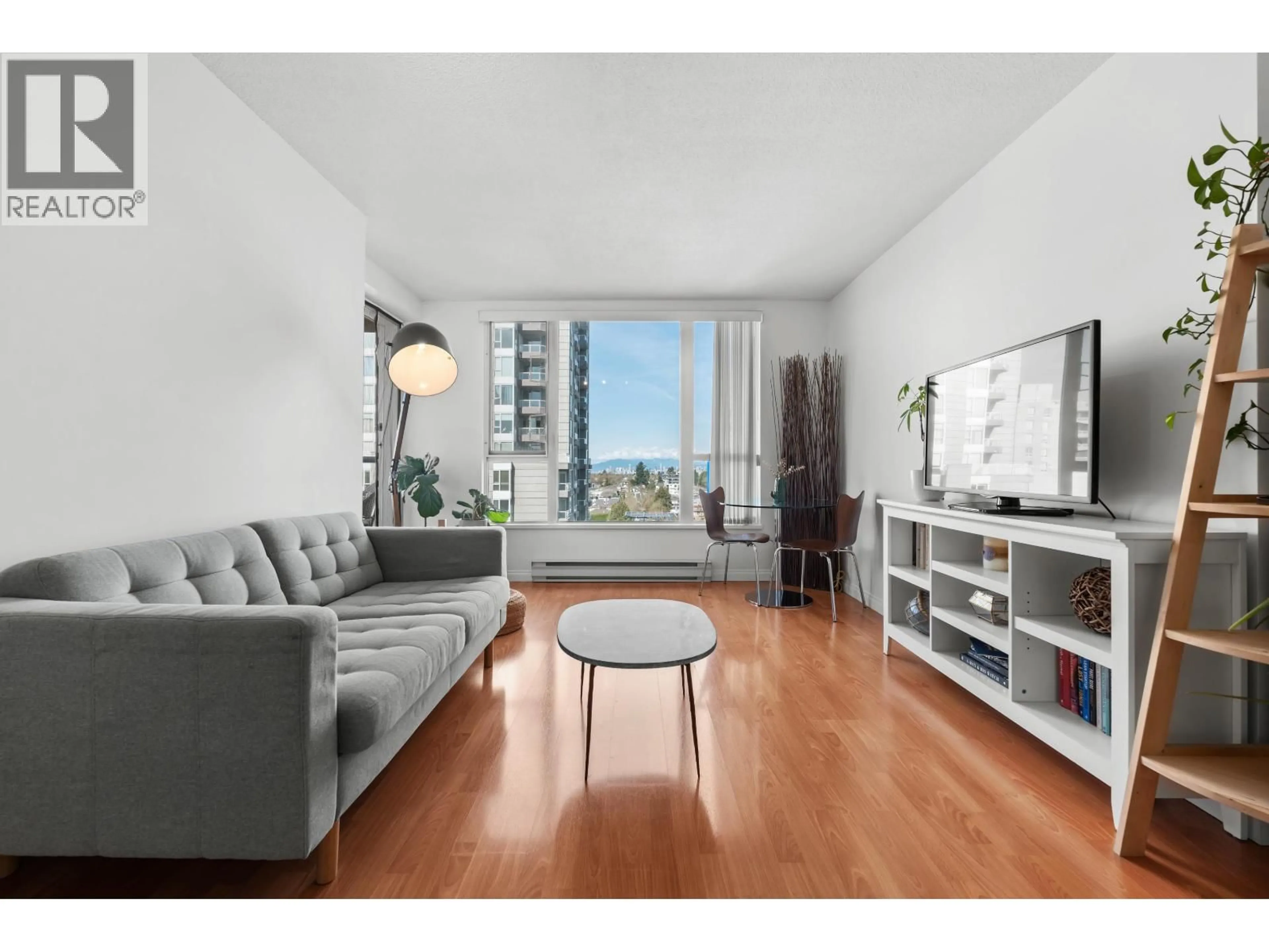 Living room with furniture, wood/laminate floor for 1205 - 5189 GASTON STREET, Vancouver British Columbia V5R6C7