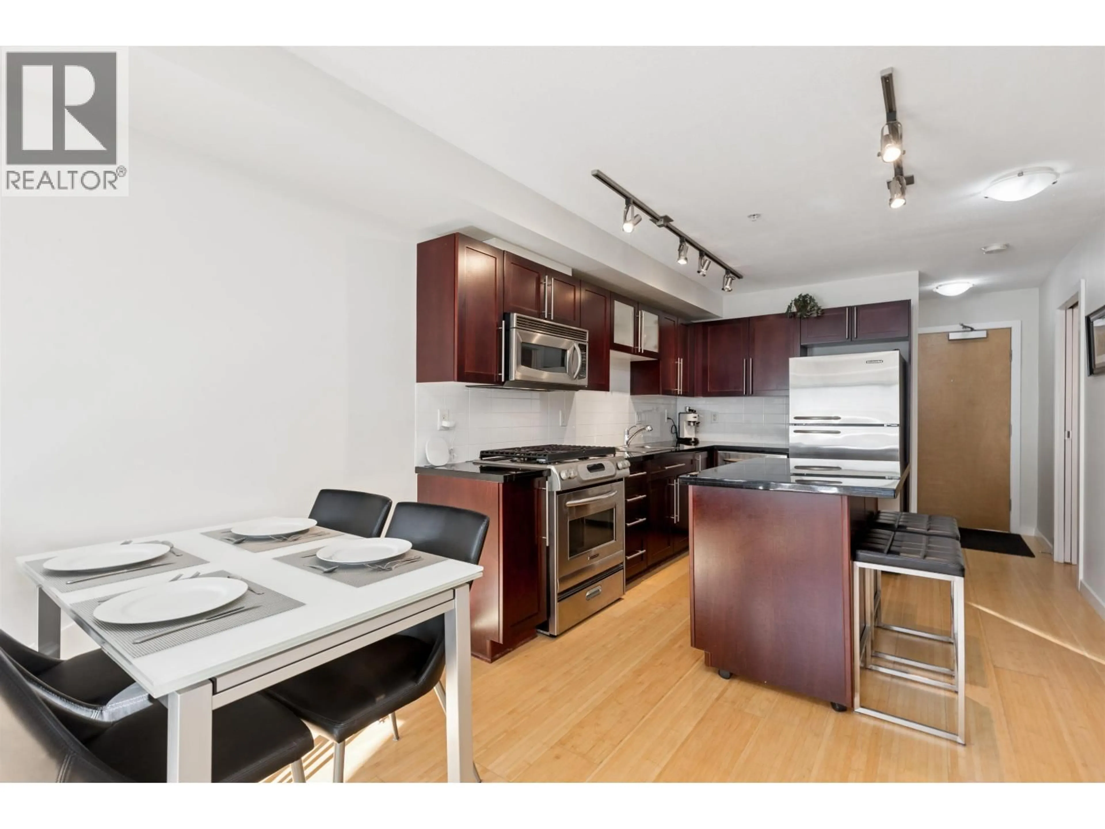 Open concept kitchen, wood/laminate floor for 311 - 122 3RD STREET, North Vancouver British Columbia V7L1E6