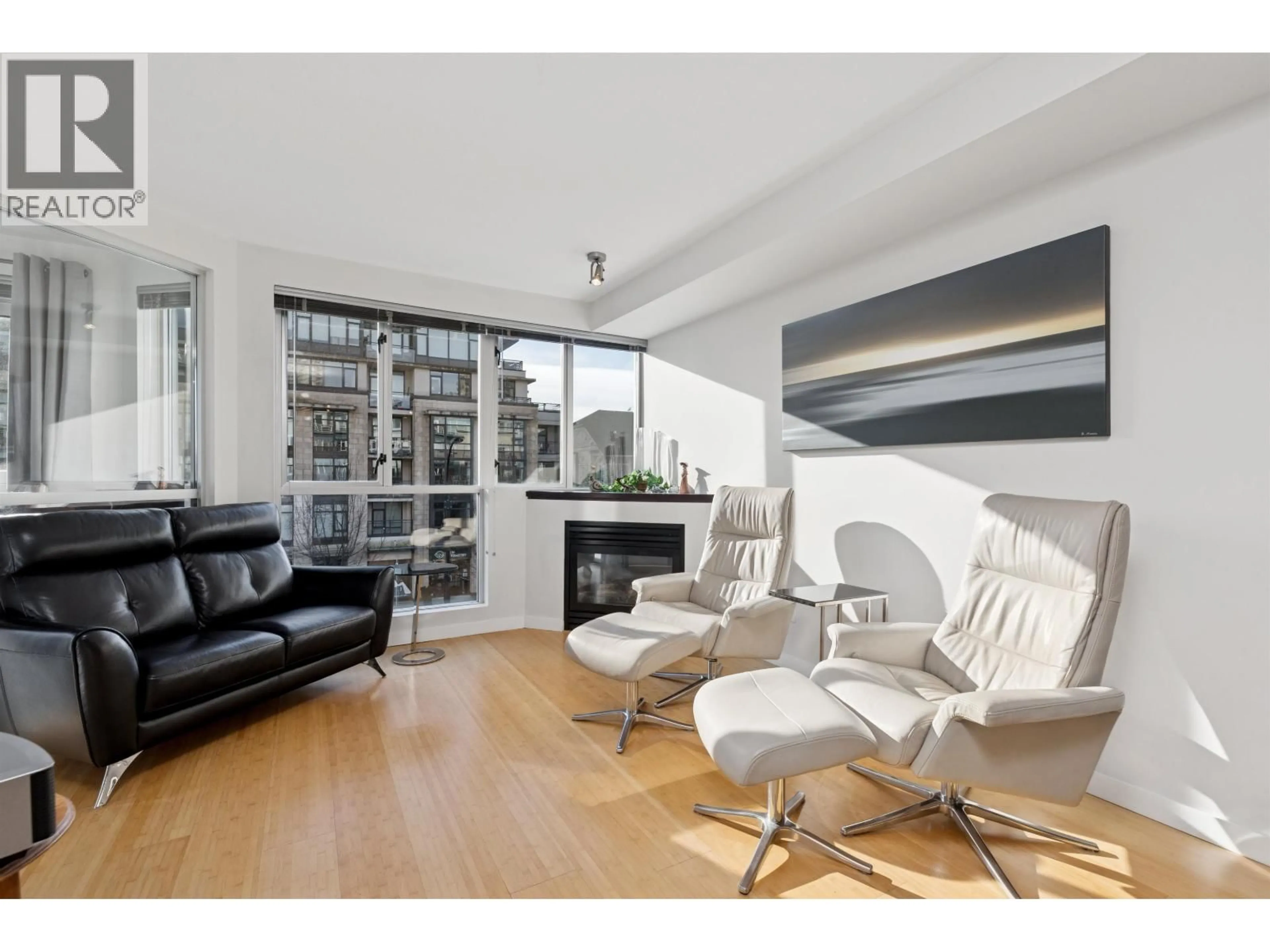 Living room with furniture, wood/laminate floor for 311 - 122 3RD STREET, North Vancouver British Columbia V7L1E6