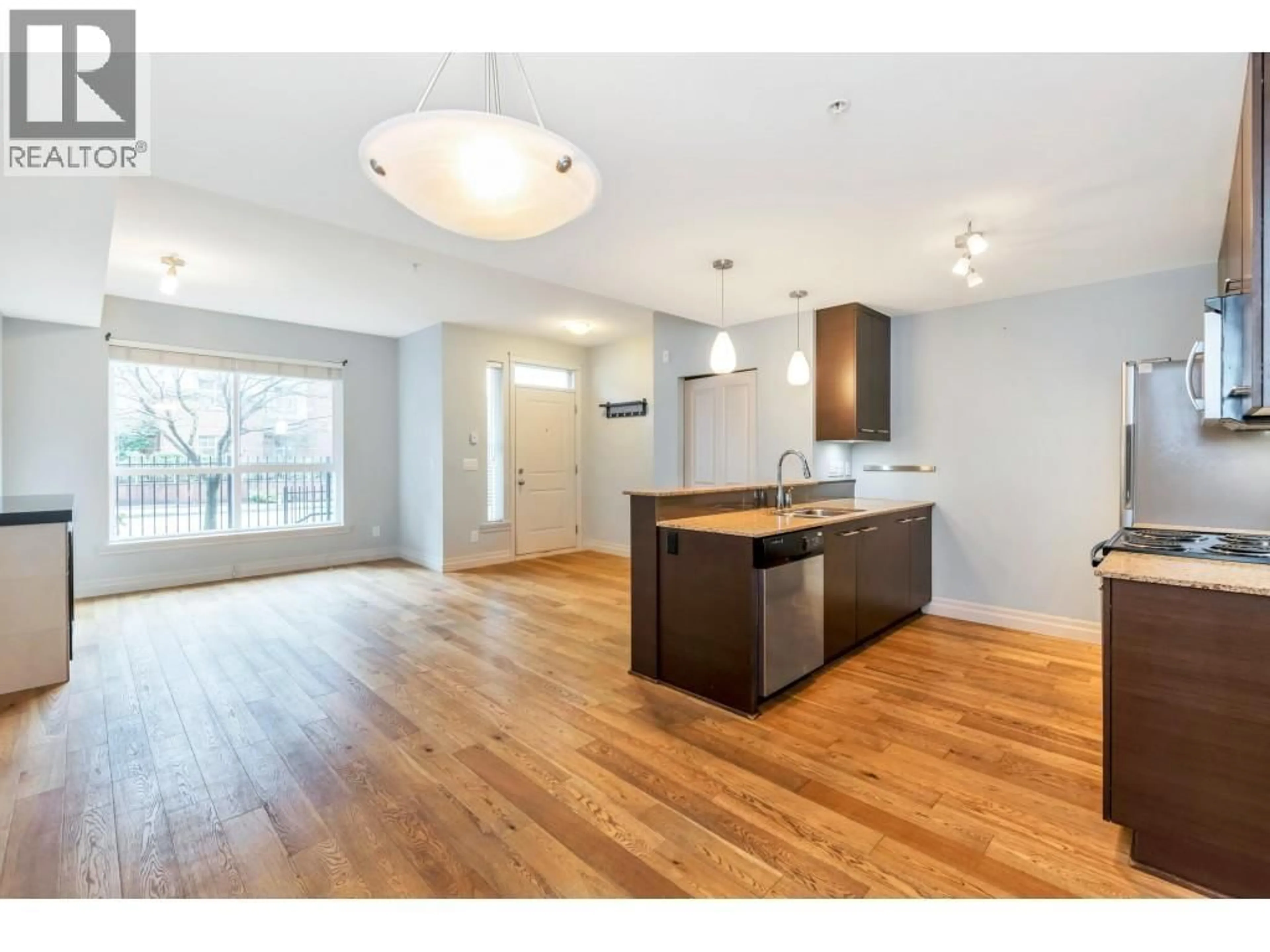Open concept kitchen, wood/laminate floor for 103 - 2343 ATKINS AVENUE, Port Coquitlam British Columbia V3C1Y7