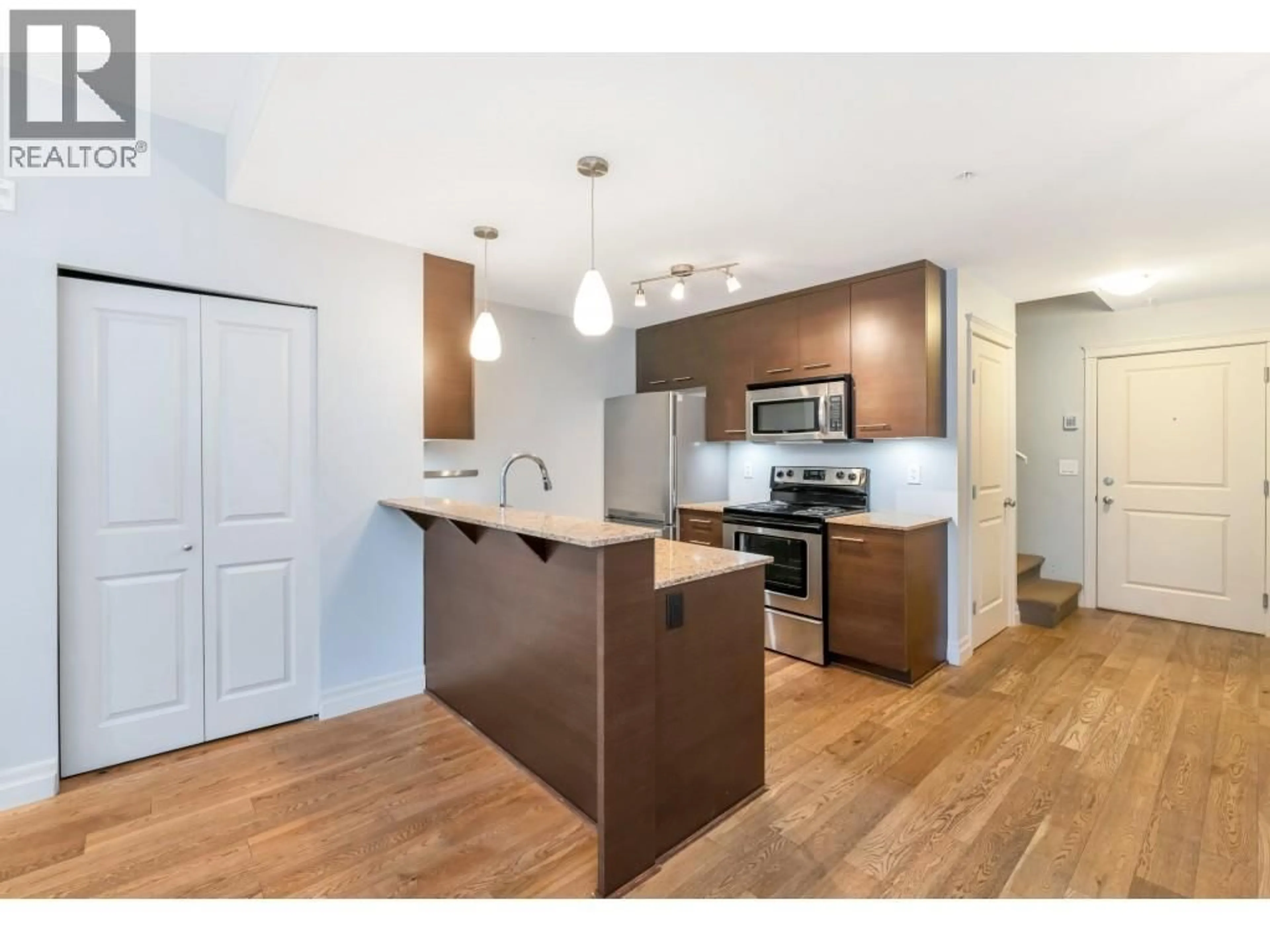 Open concept kitchen, wood/laminate floor for 103 - 2343 ATKINS AVENUE, Port Coquitlam British Columbia V3C1Y7