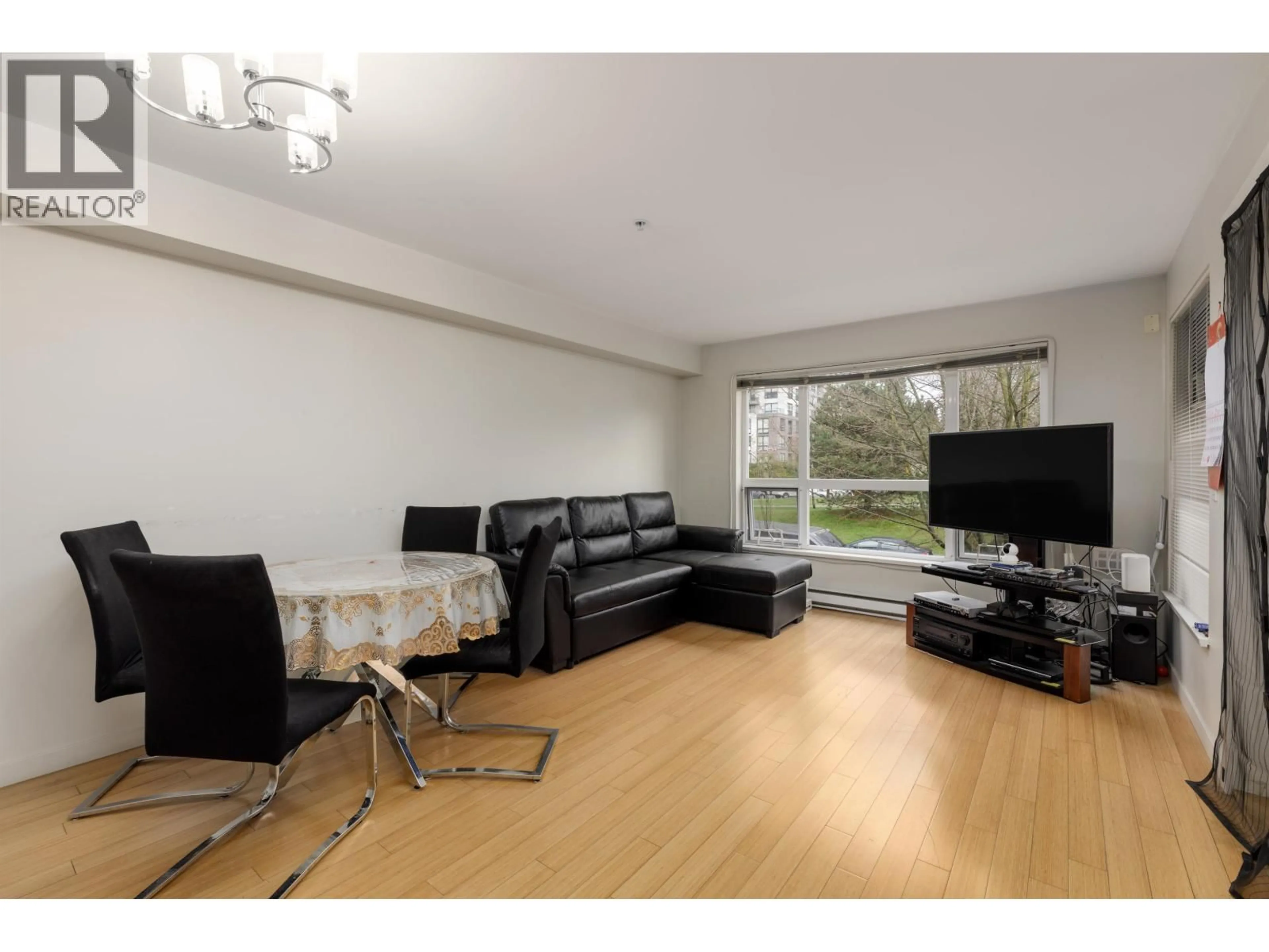Living room with furniture, wood/laminate floor for 214 - 3575 EUCLID AVENUE, Vancouver British Columbia V5R6H5