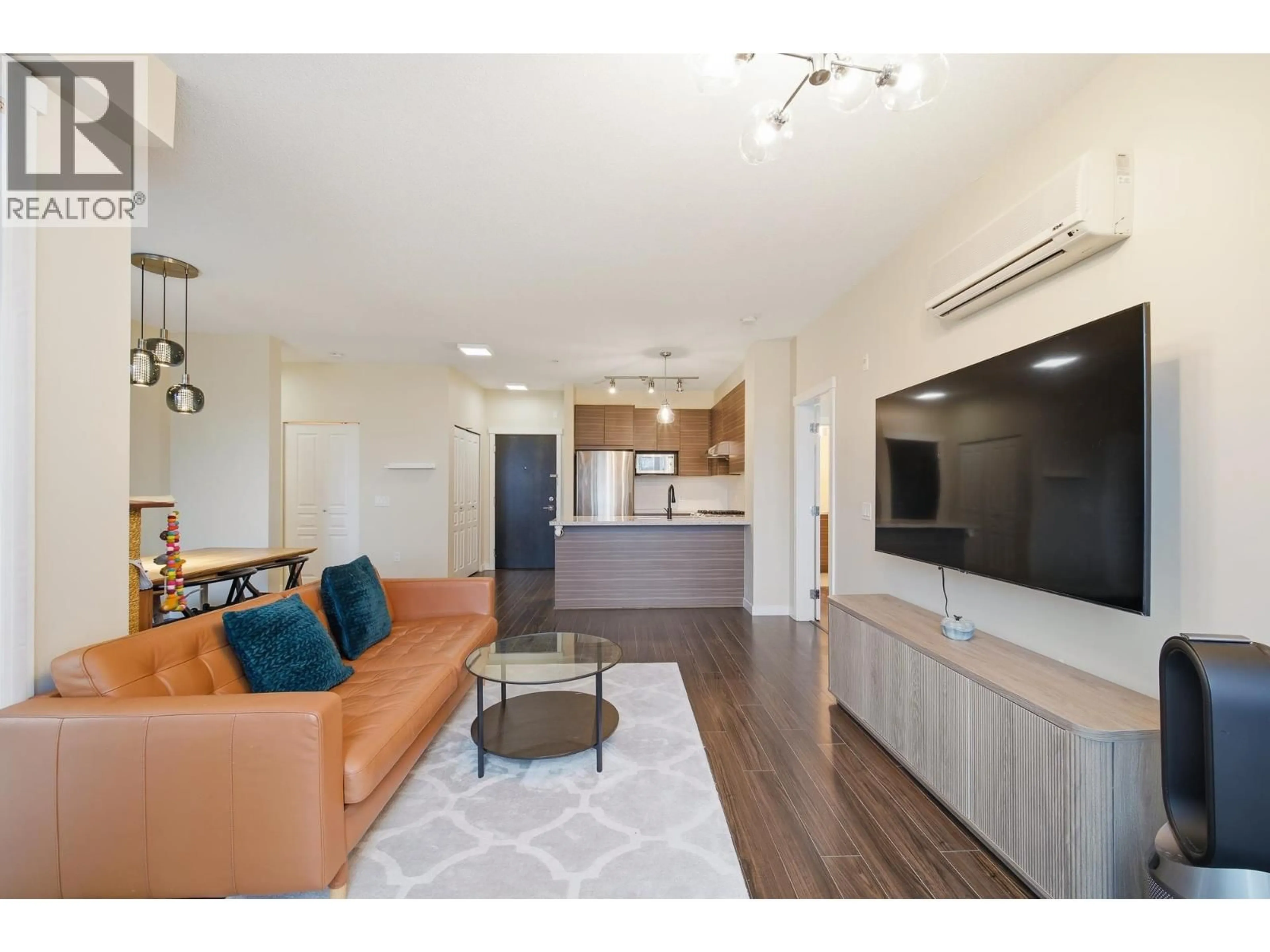 Living room with furniture, wood/laminate floor for 339 - 9388 MCKIM WAY, Richmond British Columbia V6X0J7