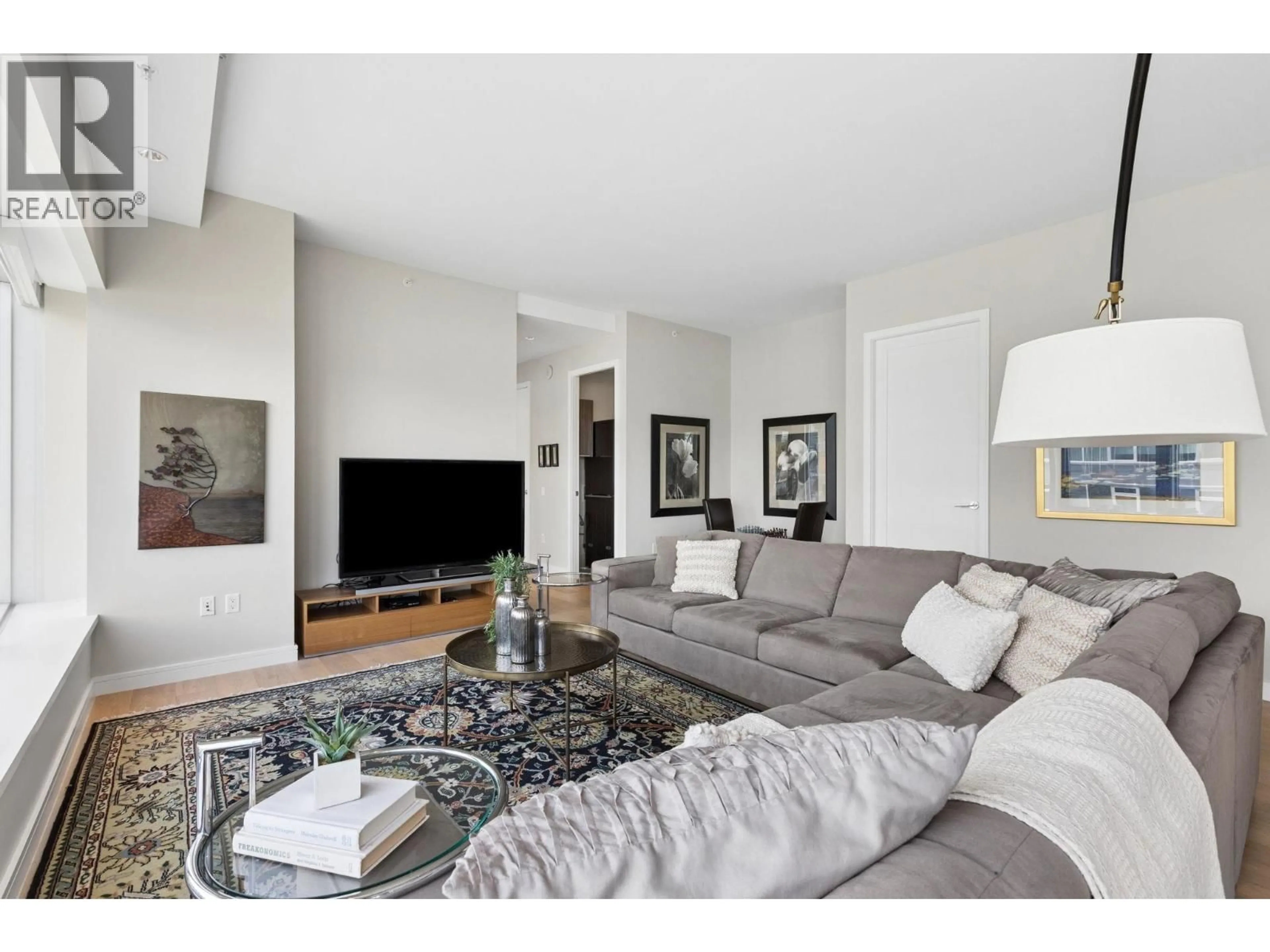 Living room with furniture, unknown for 603 - 181 ATHLETES WAY, Vancouver British Columbia V5Y0E5