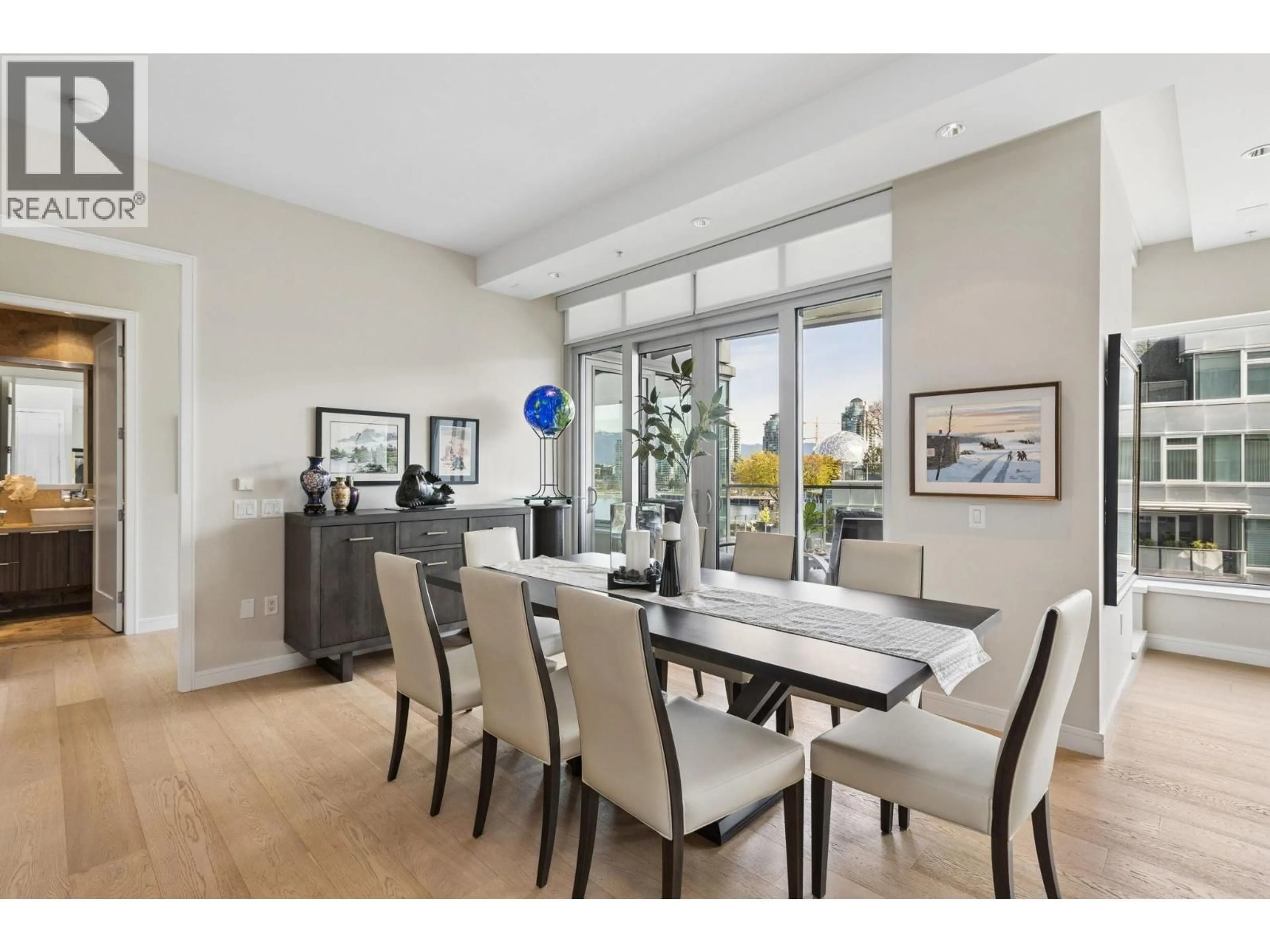 Dining room, wood/laminate floor for 603 - 181 ATHLETES WAY, Vancouver British Columbia V5Y0E5