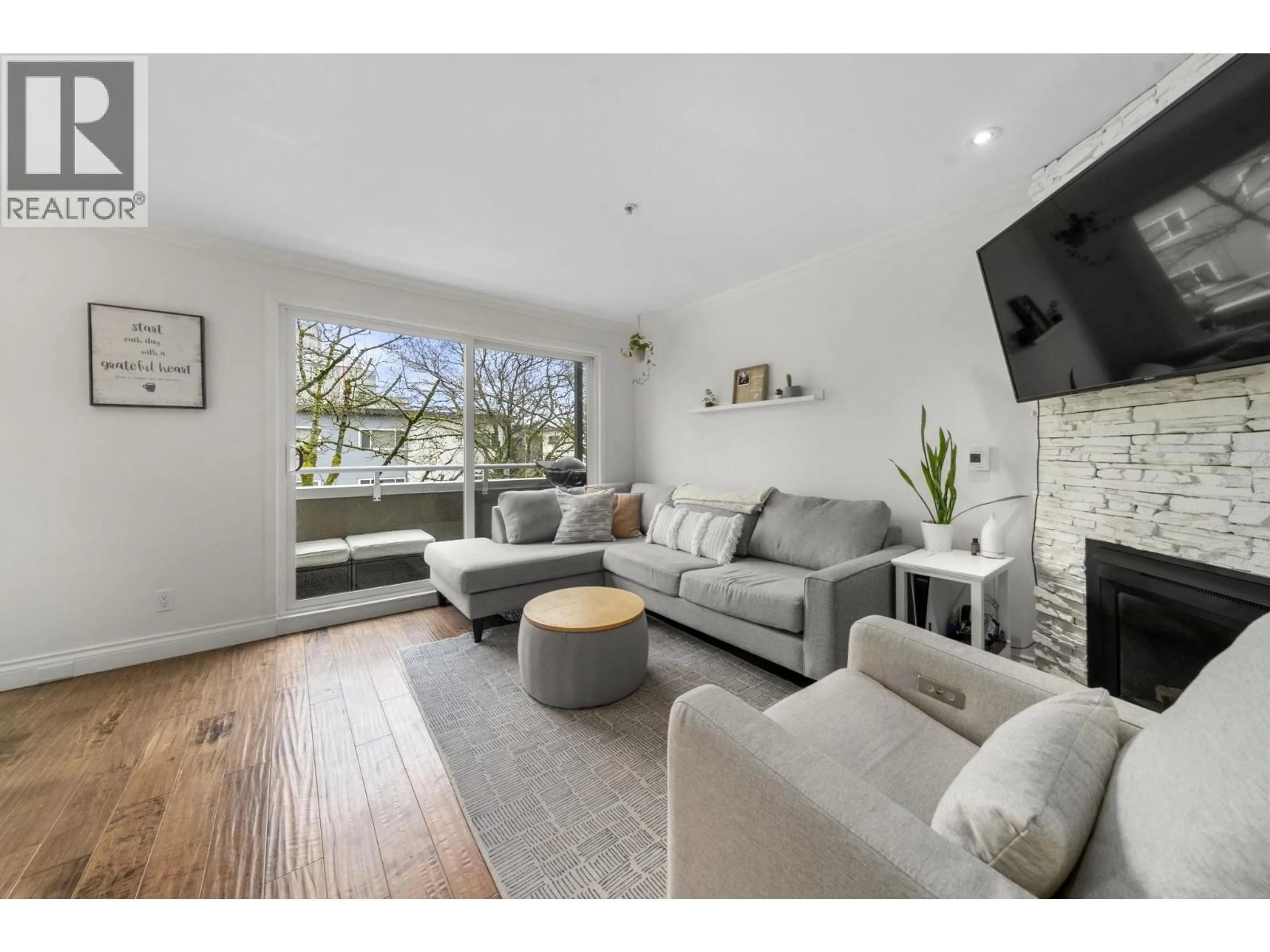 Living room with furniture, wood/laminate floor for 202 - 1106 11TH AVENUE, Vancouver British Columbia V6H1K3