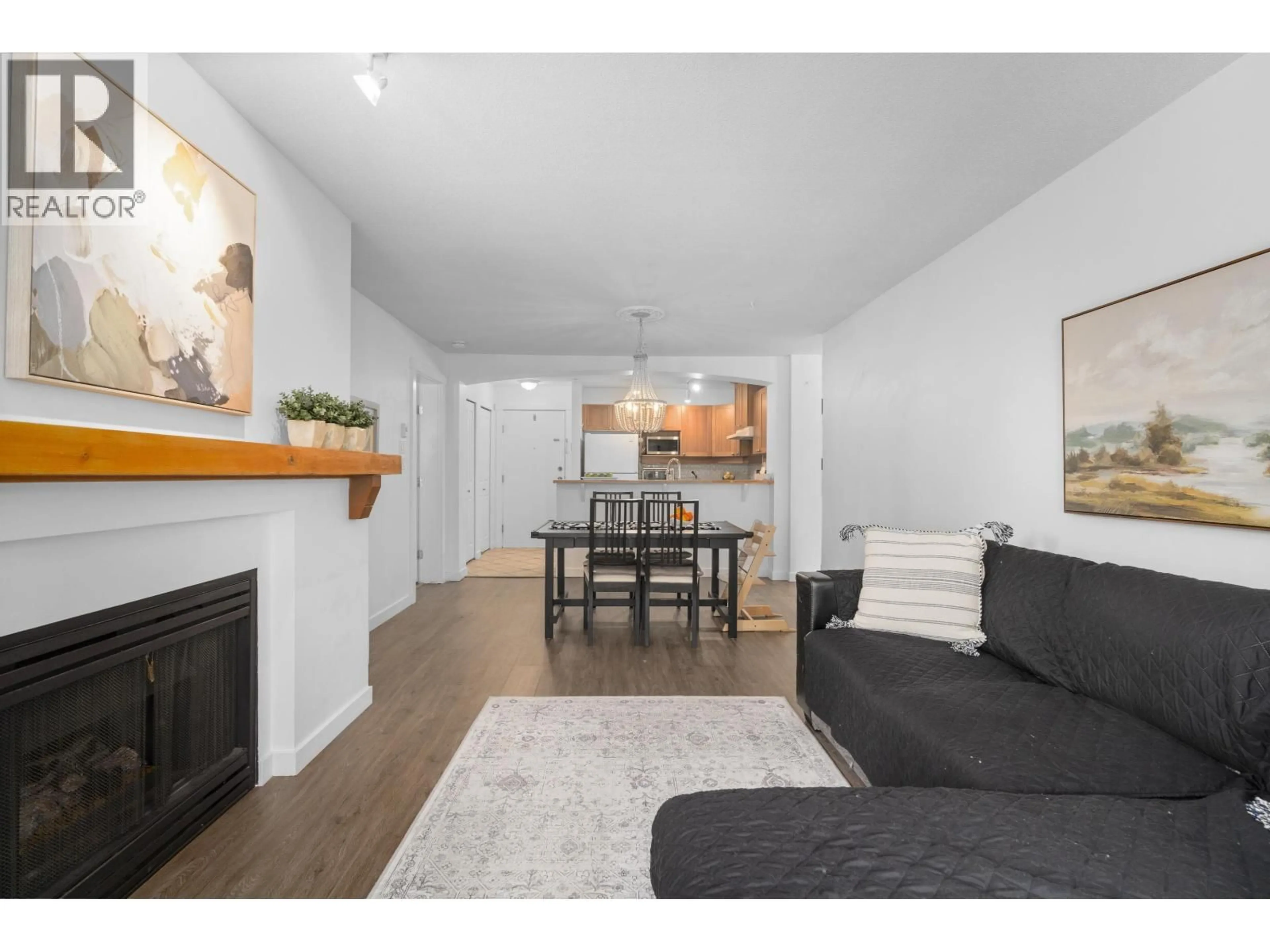 Living room with furniture, wood/laminate floor for 212 - 1432 PARKWAY BOULEVARD, Coquitlam British Columbia V3E3L9