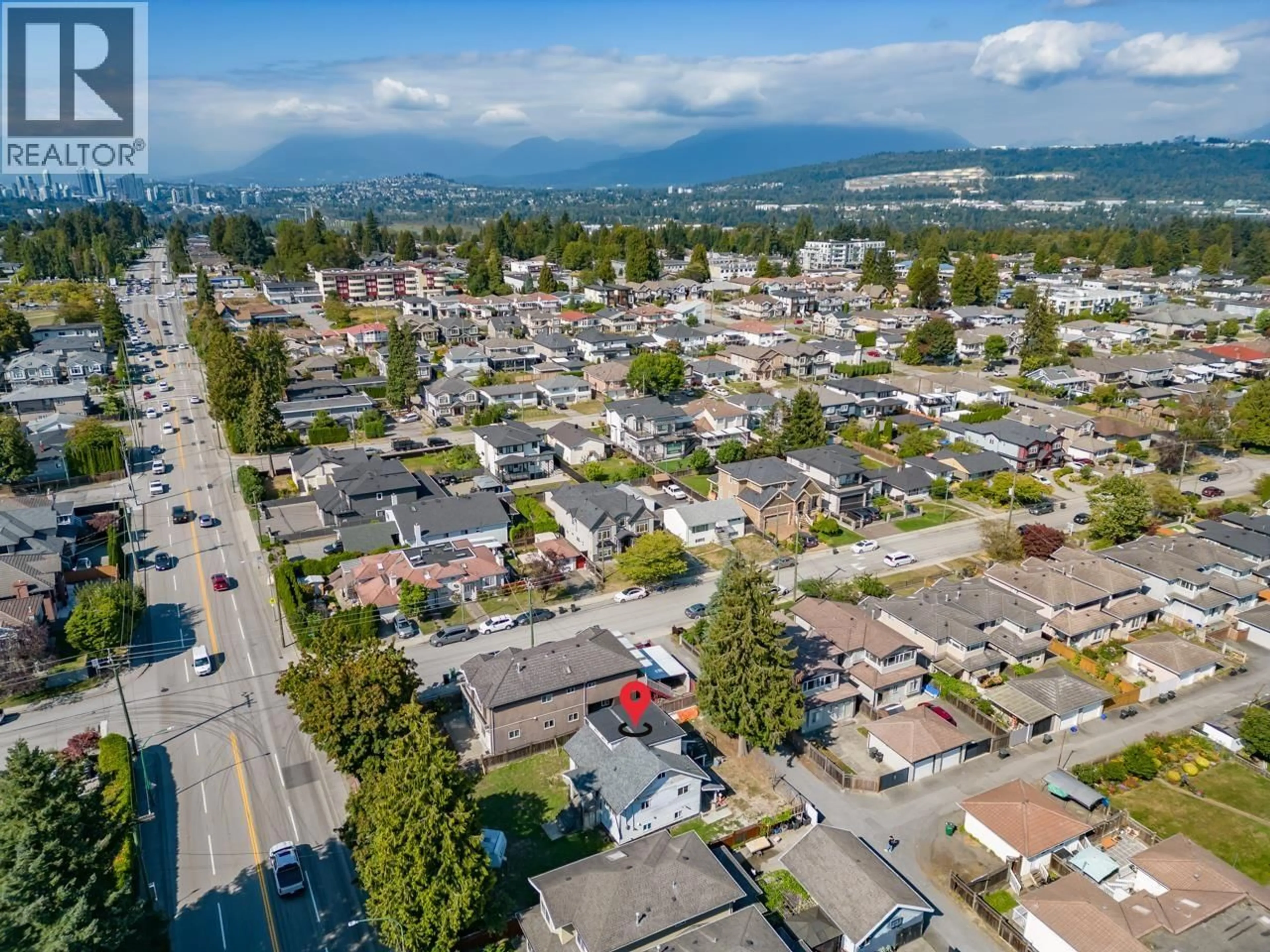 A pic from outside/outdoor area/front of a property/back of a property/a pic from drone, mountain view for 7520 CANADA WAY, Burnaby British Columbia V3N3K2